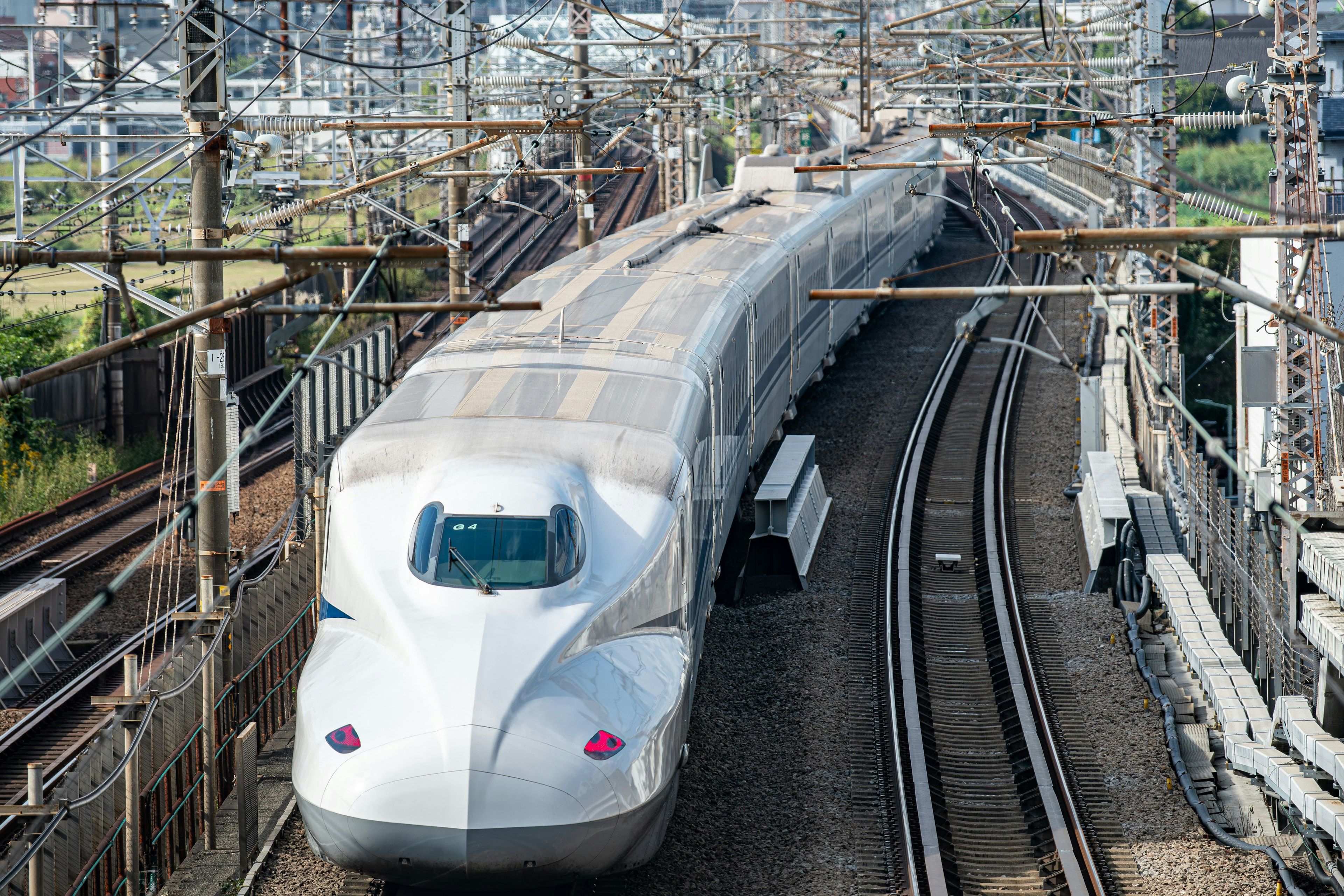 Shinkansen train navigating curved tracks