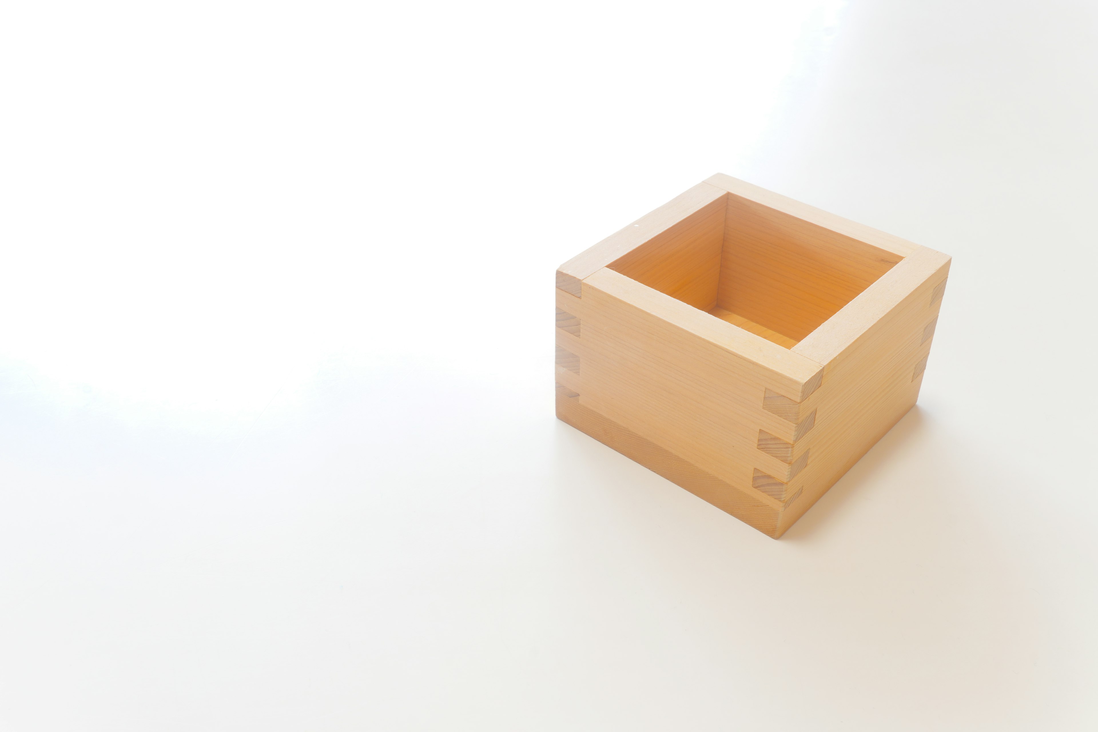 Small wooden box placed on a white background