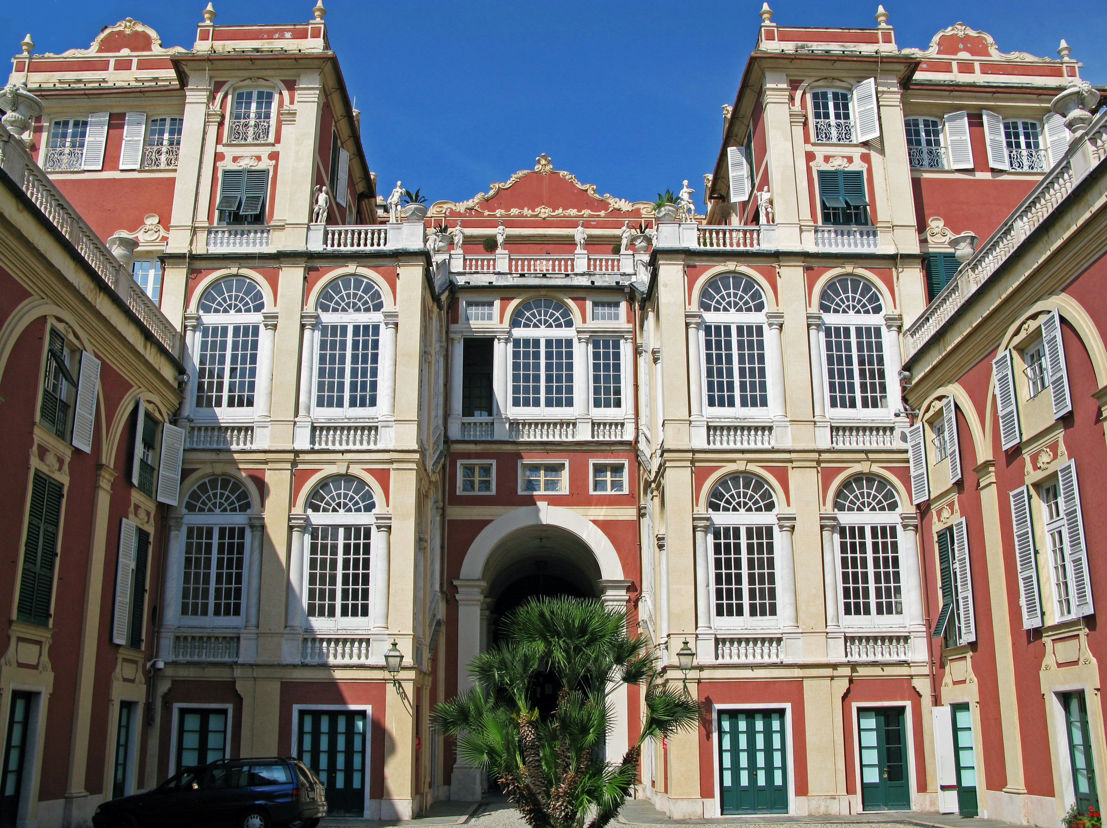 Grand building facade with red and white decorations