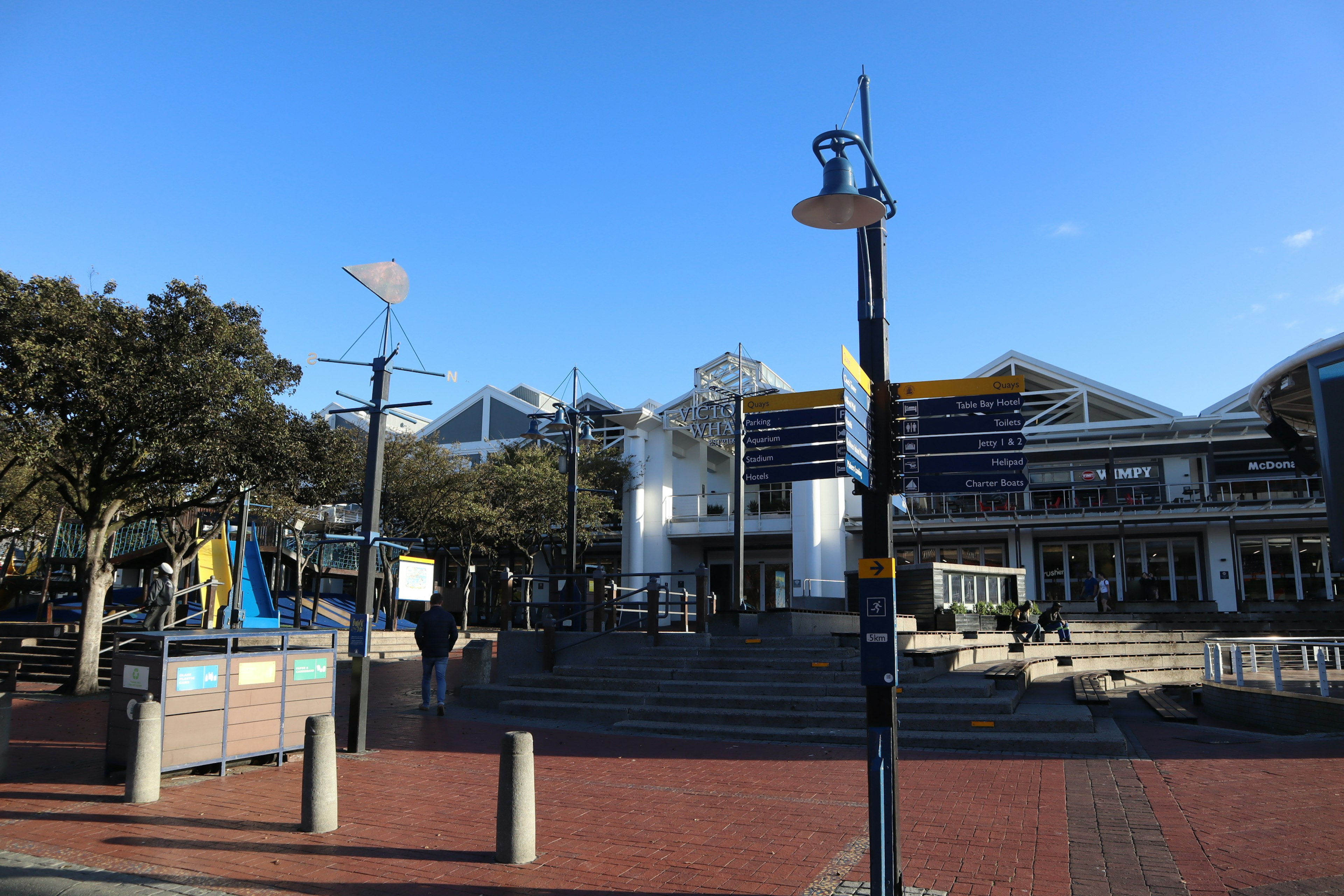 Open plaza with buildings and clear blue sky