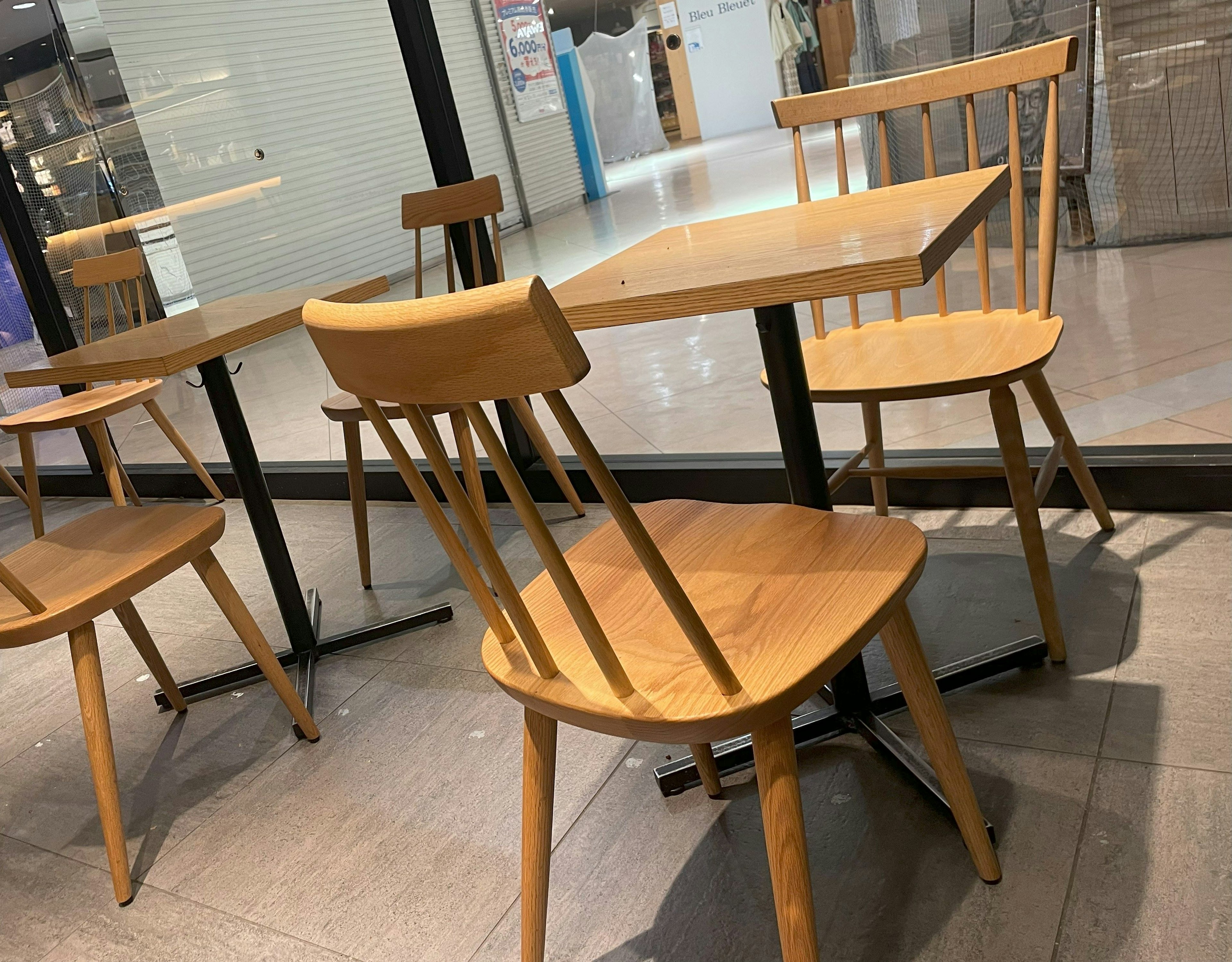 Wooden chairs and table in a cafe interior