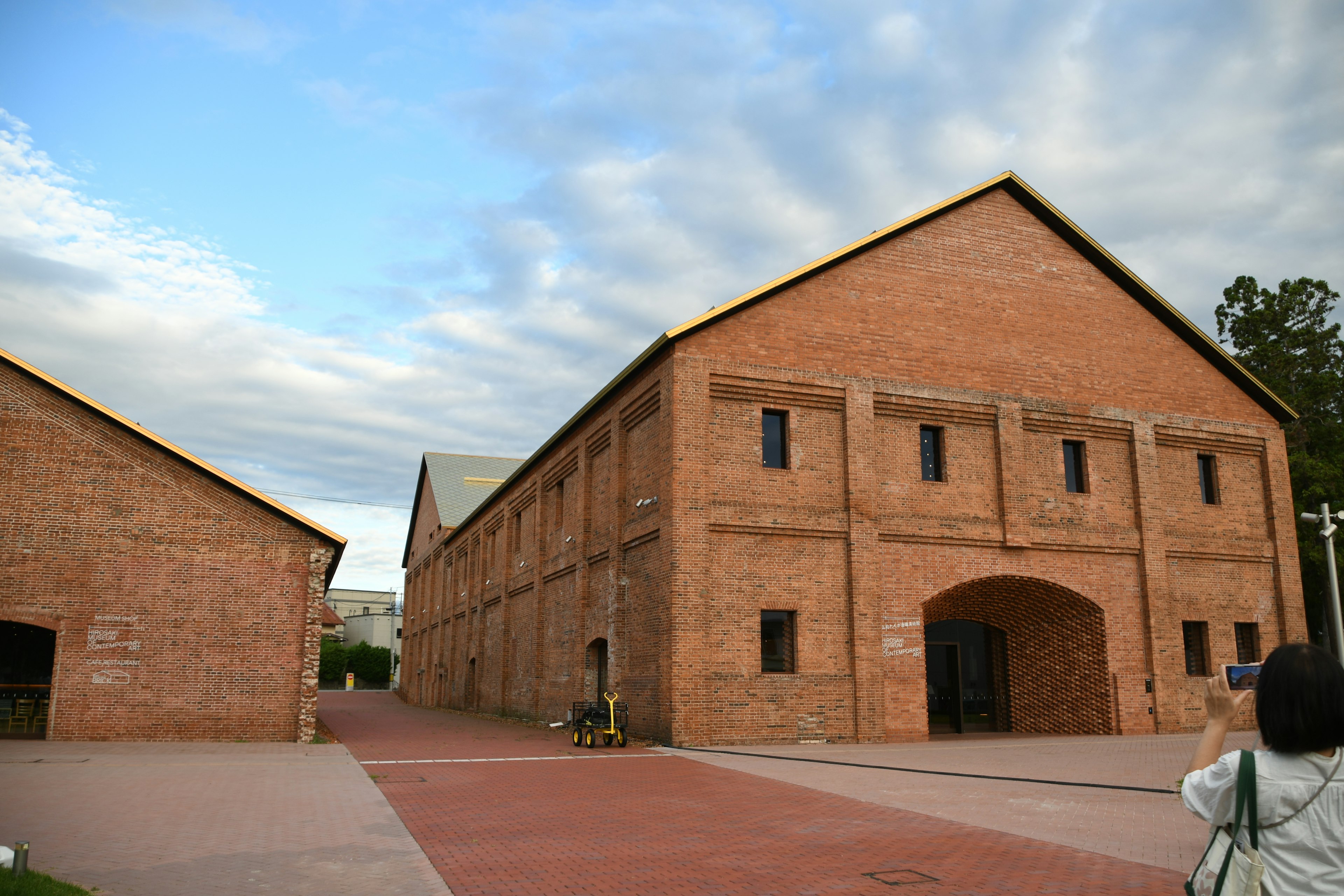 Red brick building under a cloudy sky