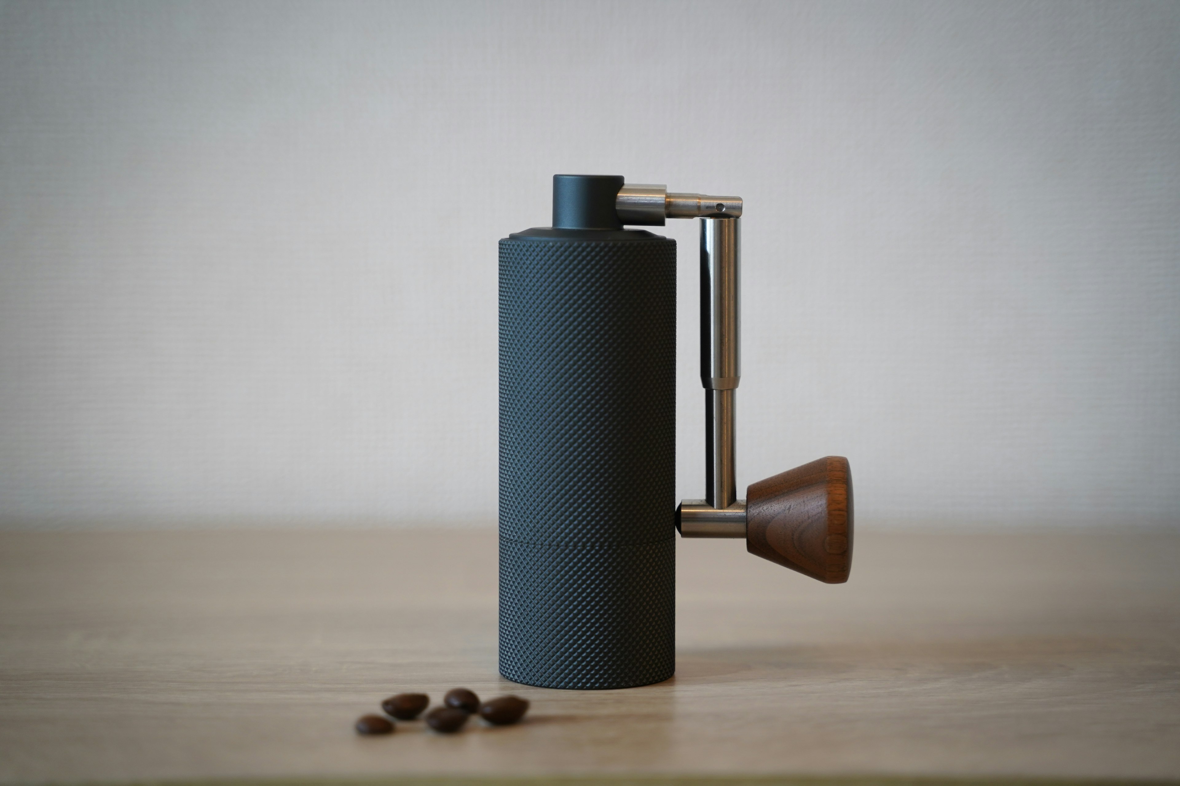 Stylish coffee grinder design with wooden handle