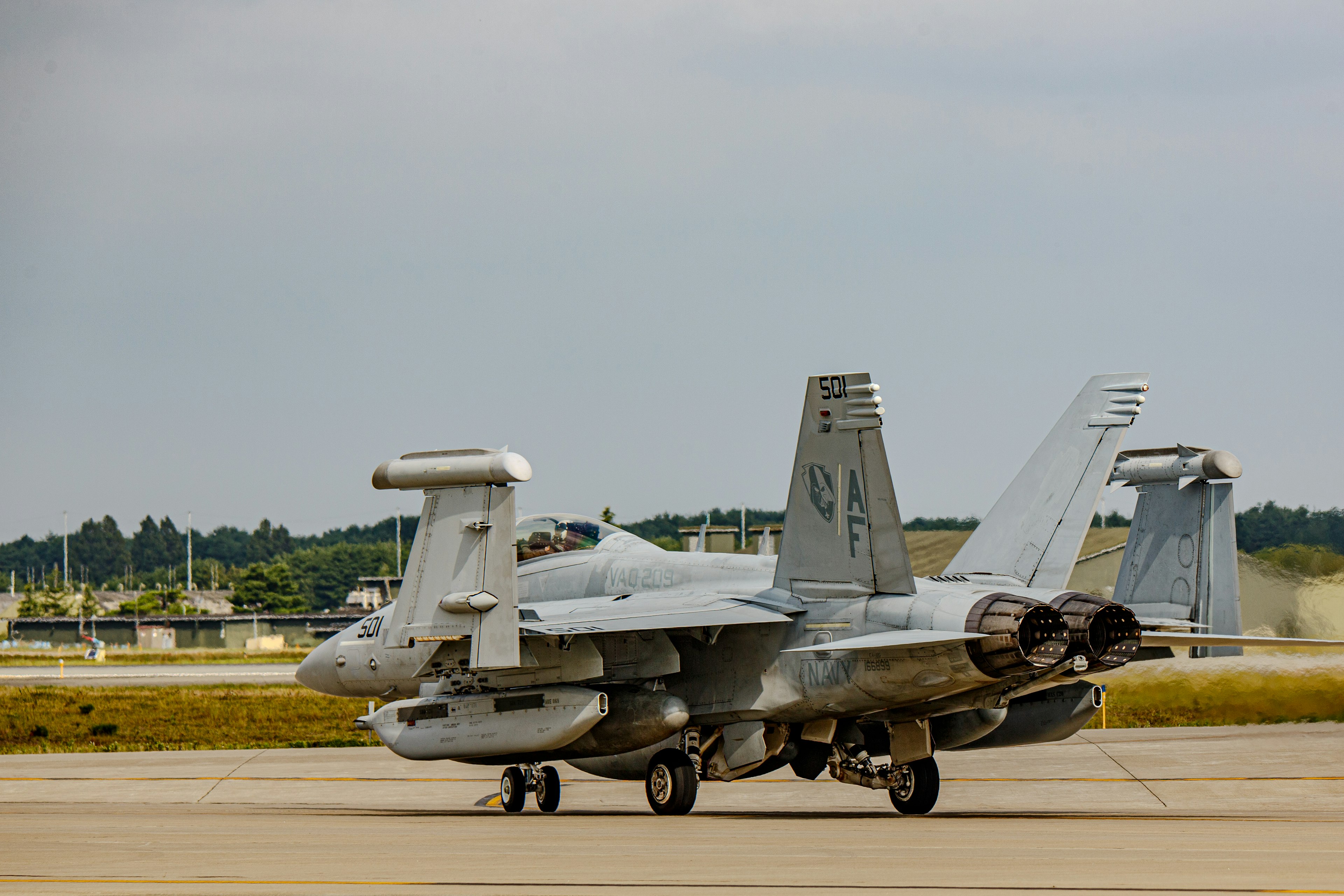 Military aircraft parked on the runway