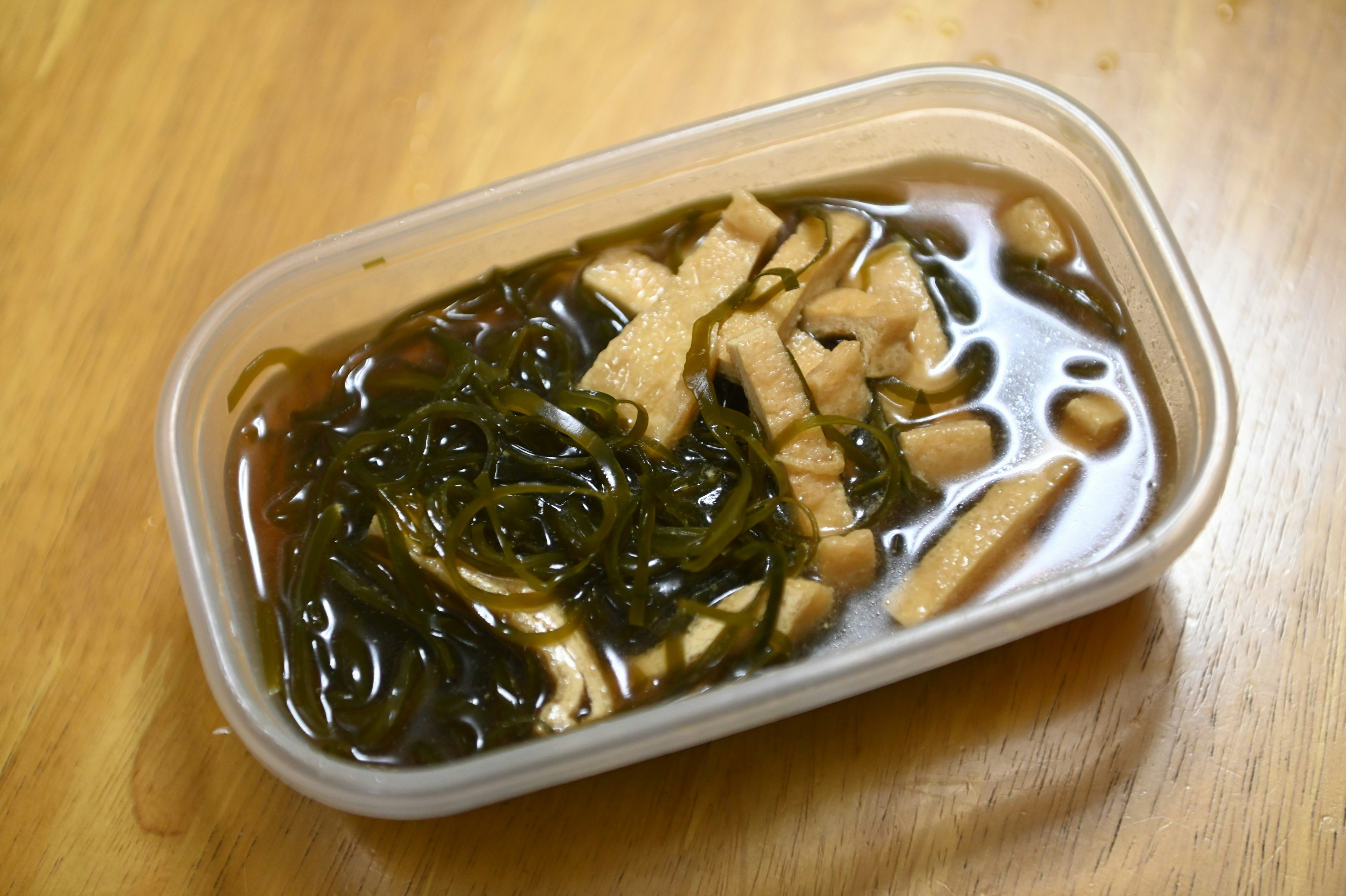 Japanese-style soup with seaweed and thinly sliced ingredients