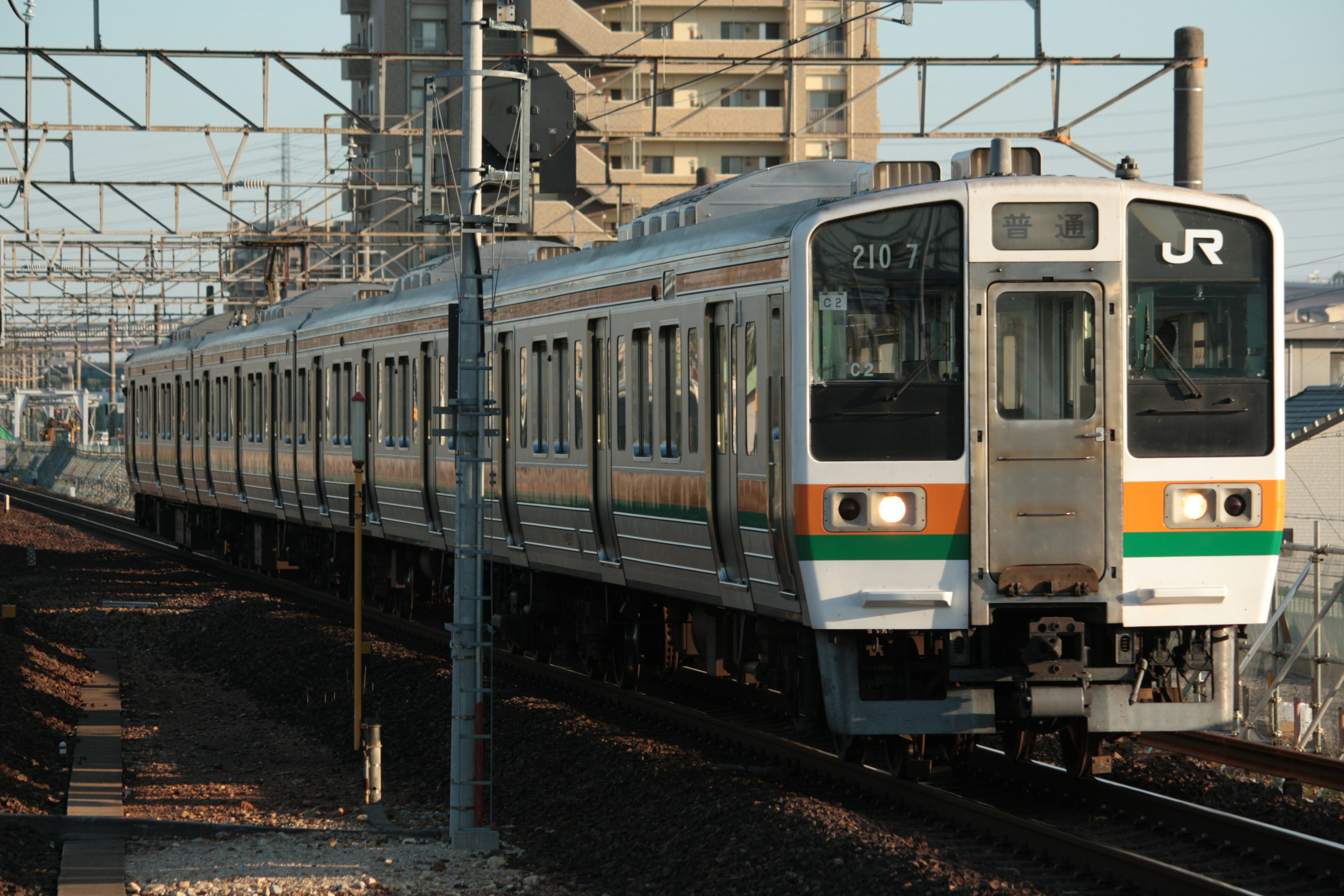 A Japanese train traveling along the tracks