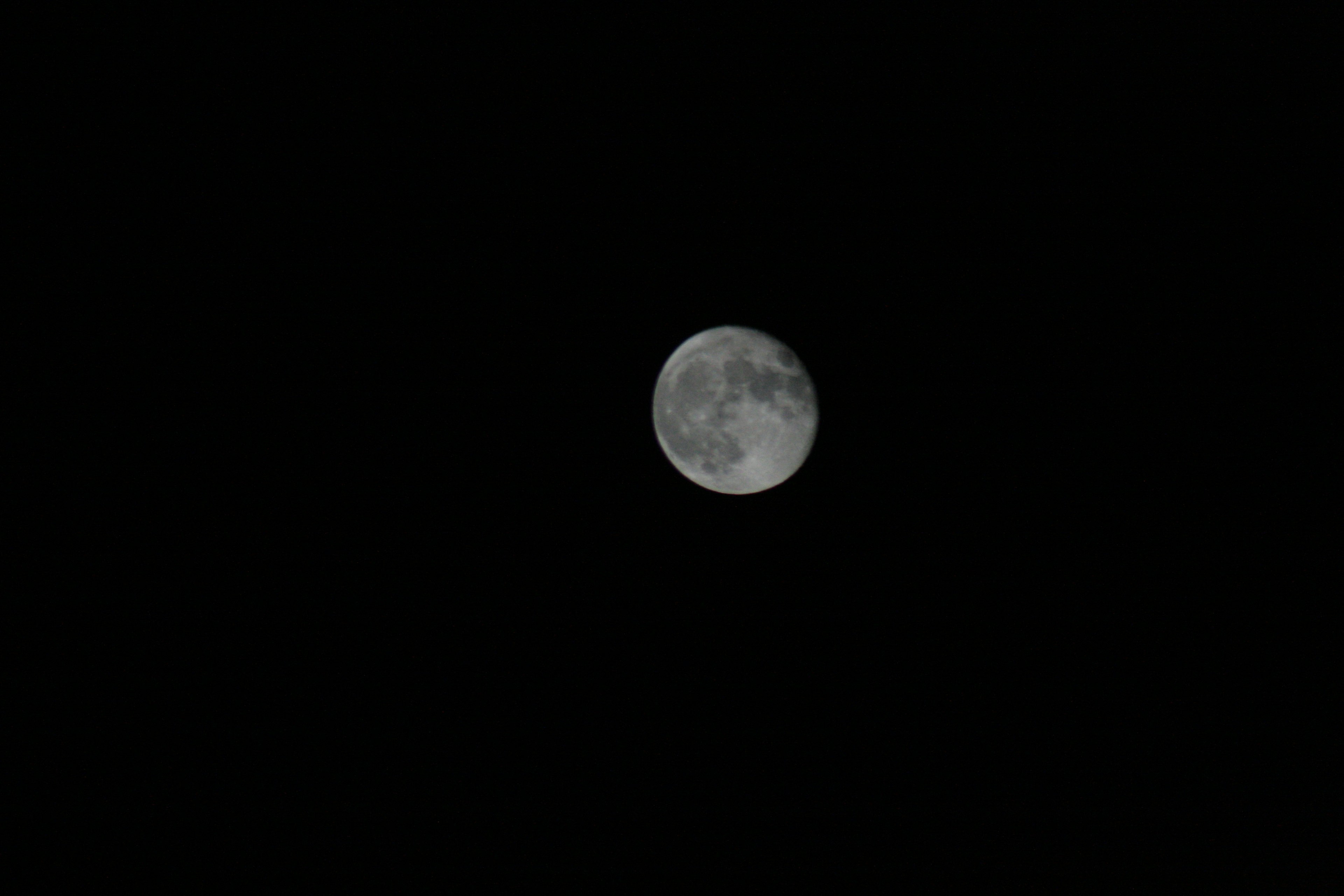 Close-up of a bright moon in the night sky