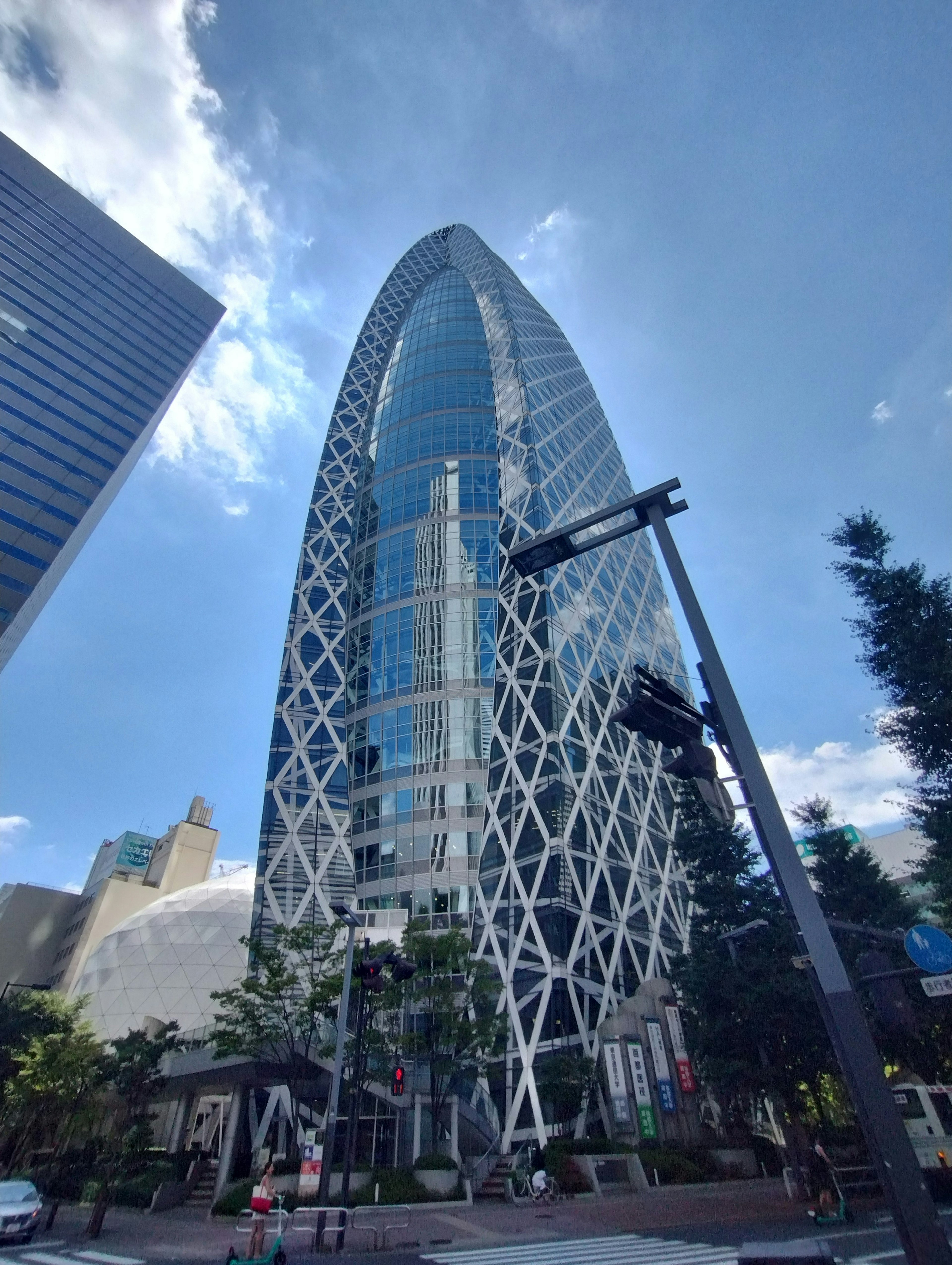 Futuristic design skyscraper towering under a blue sky