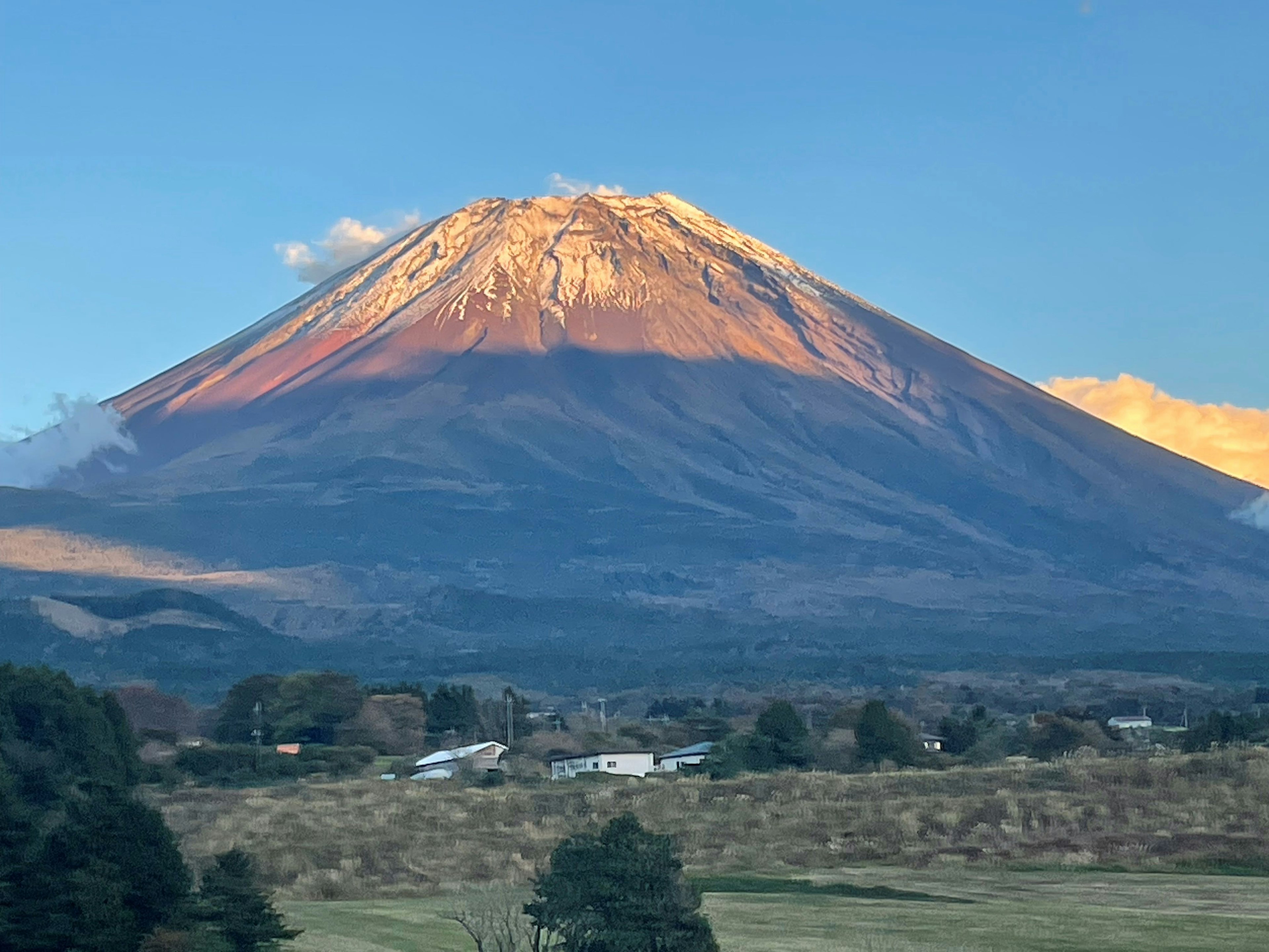 Scenic view of Mount Fuji bathed in sunset light