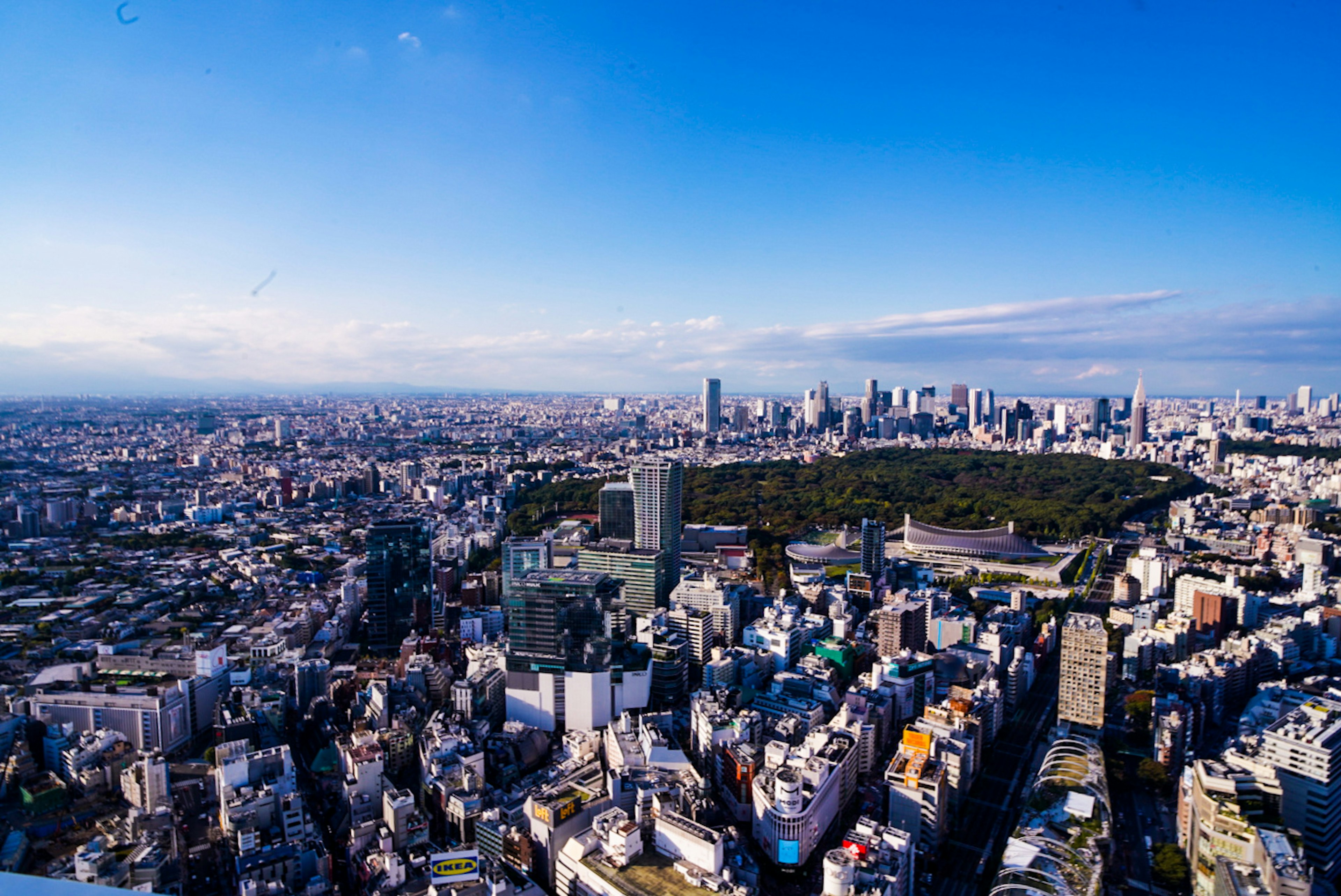 A panoramic view of Tokyo's skyscrapers and blue sky