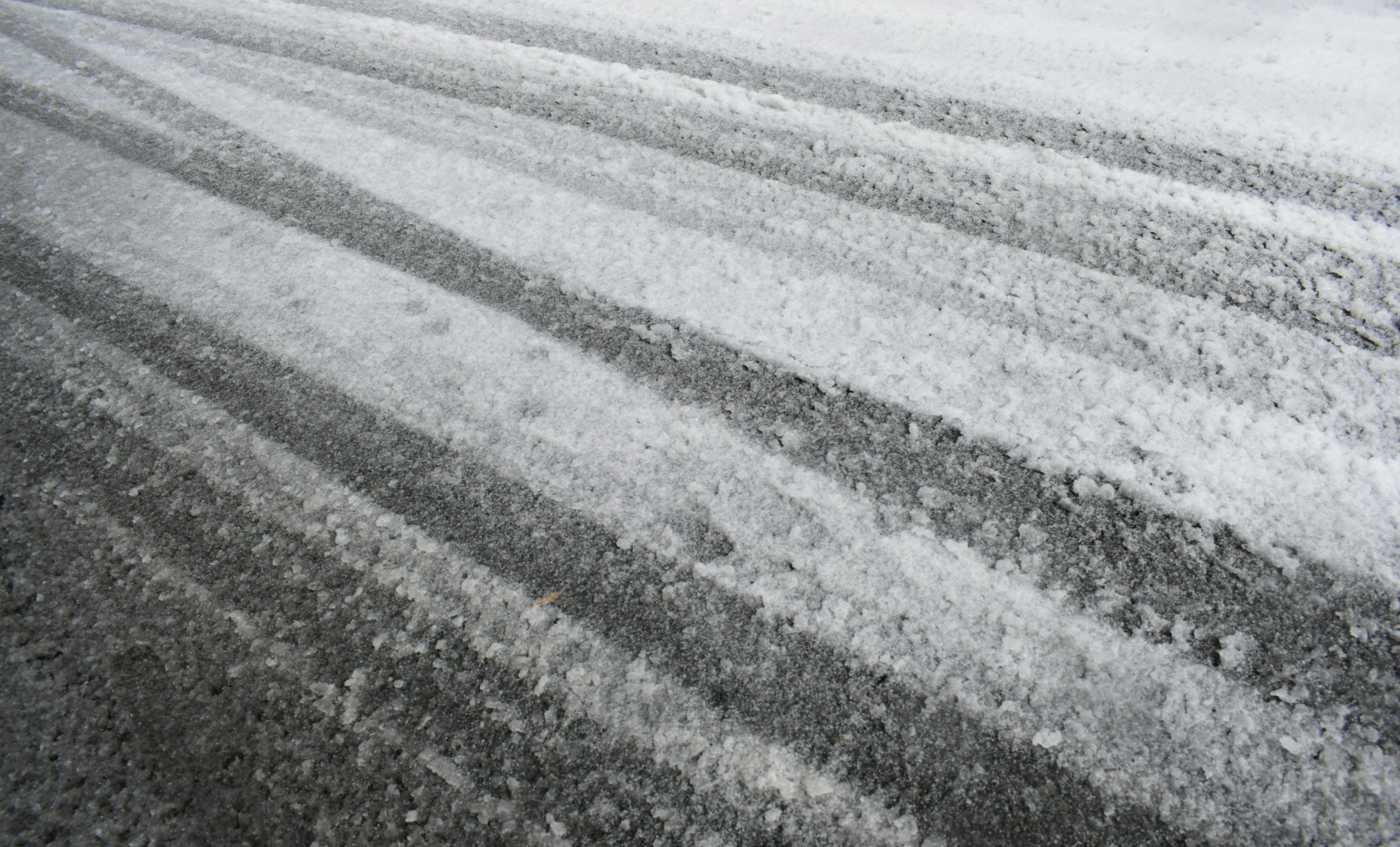 Image showing striped patterns on a snow-covered road