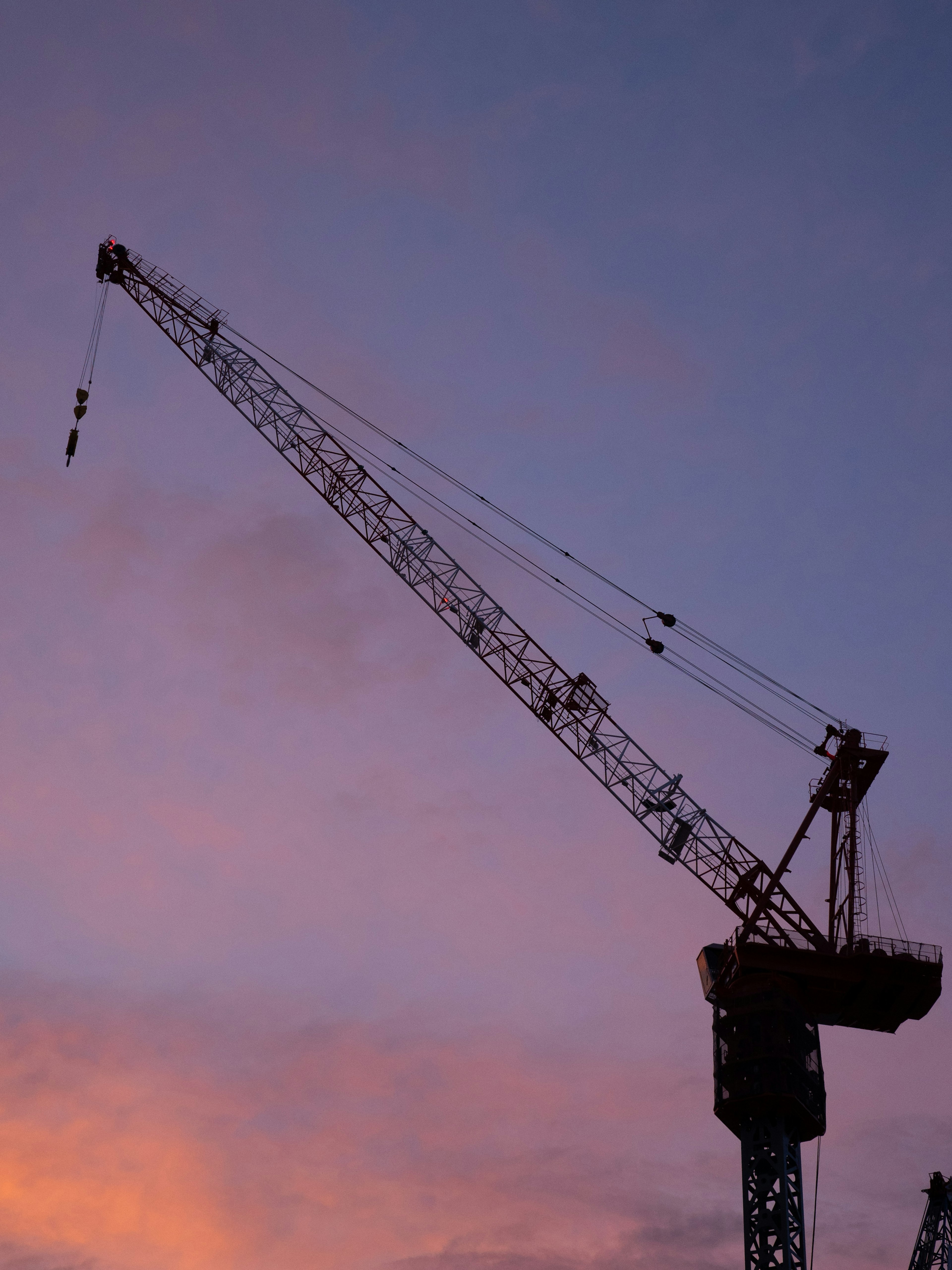 Crane silhouette against a colorful sunset sky