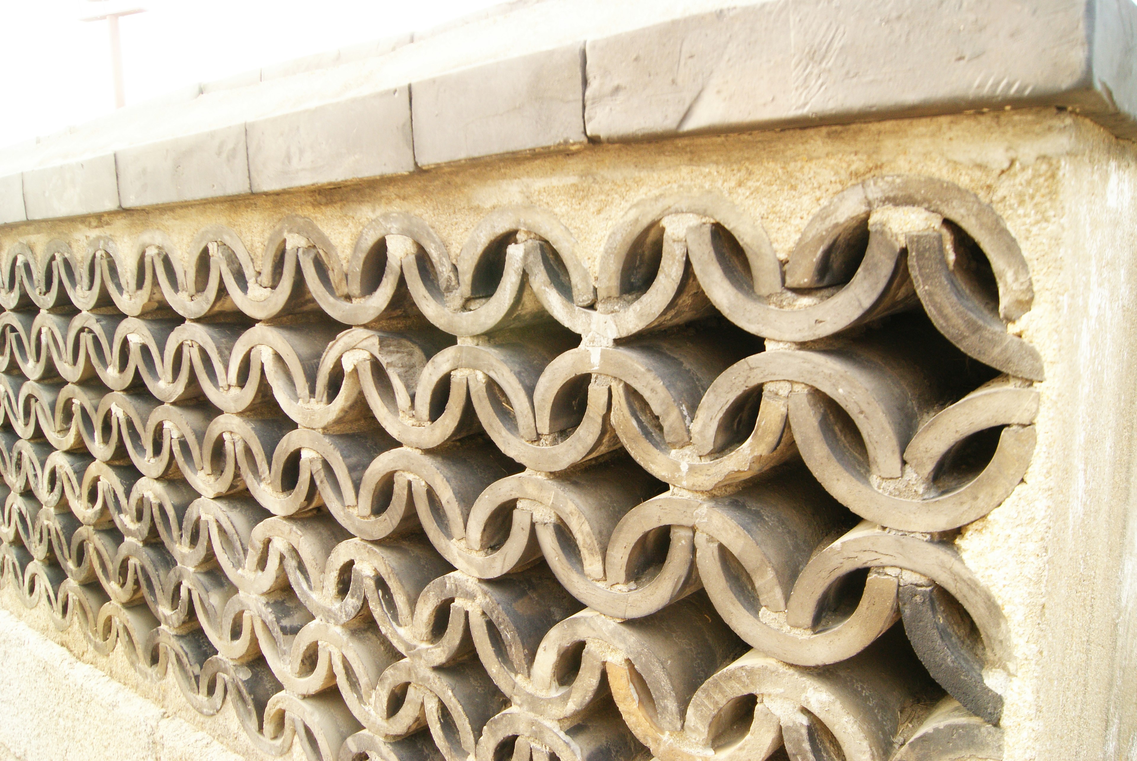 Close-up of a unique patterned concrete block wall