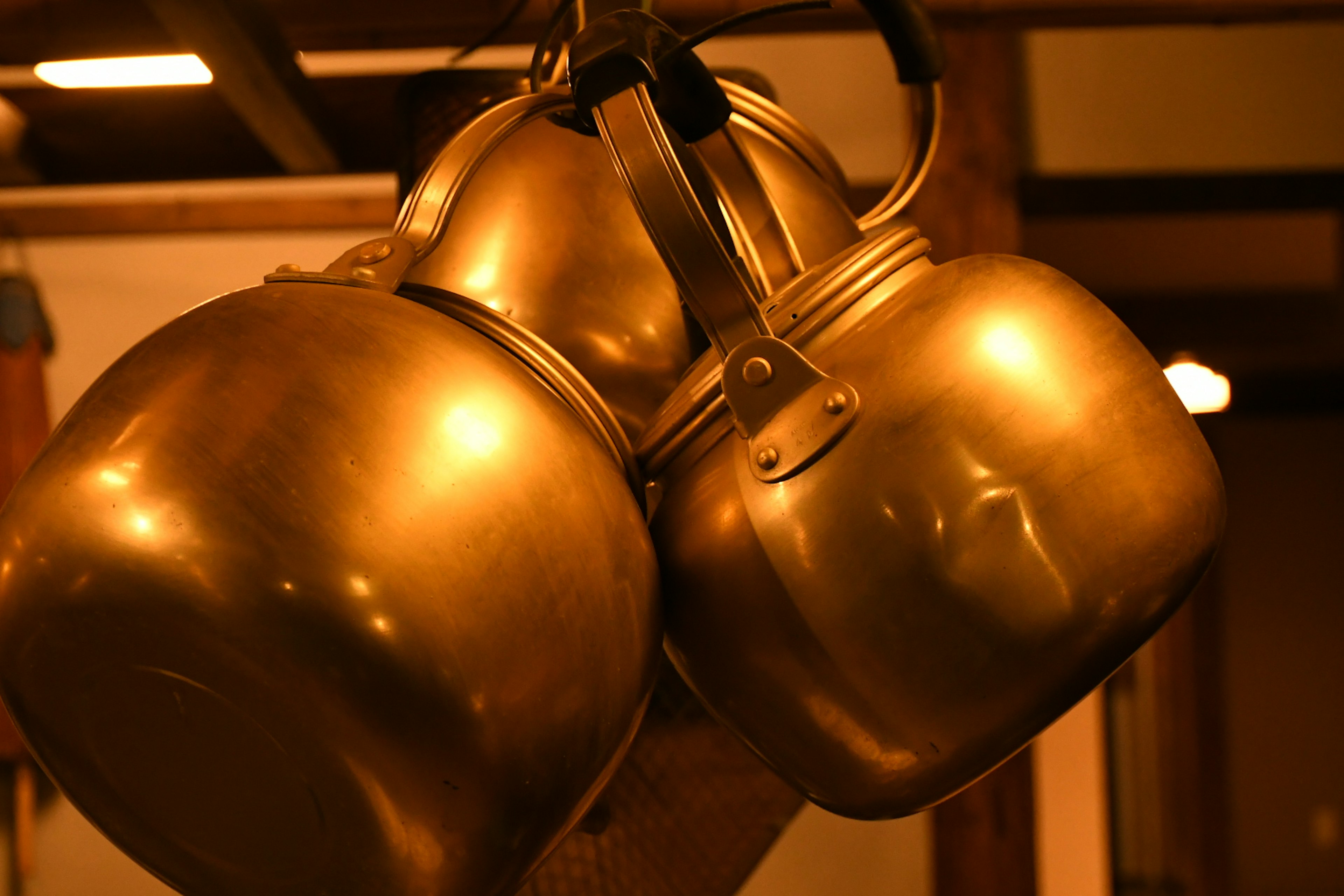 Image of golden pots hanging together