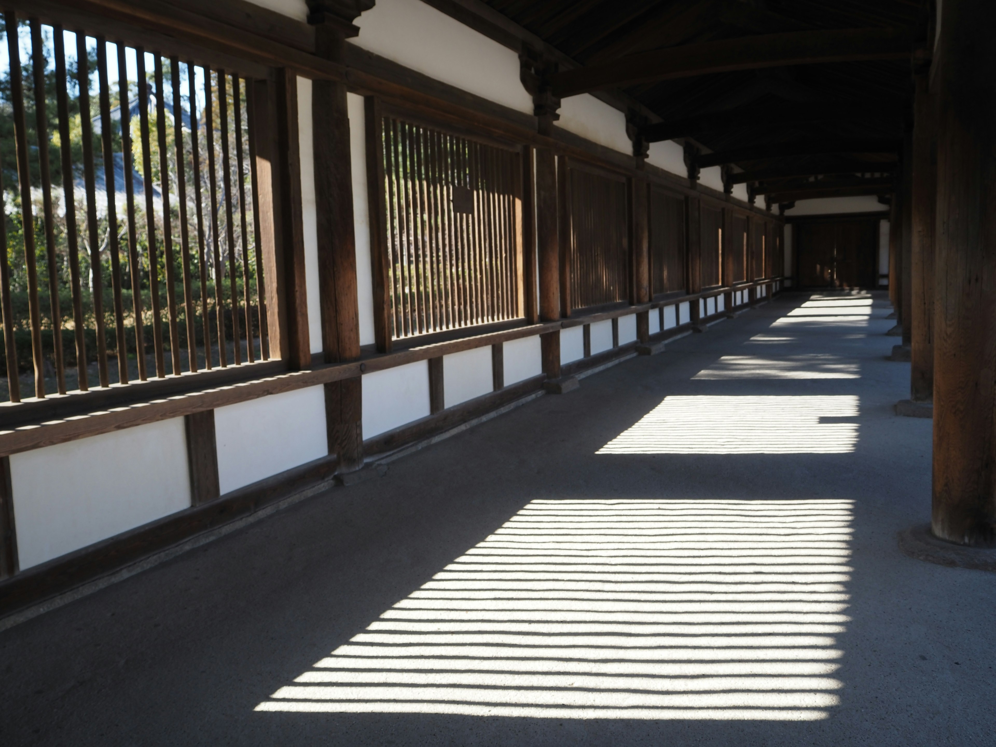 Beautiful Japanese architecture with shadows on a wooden corridor