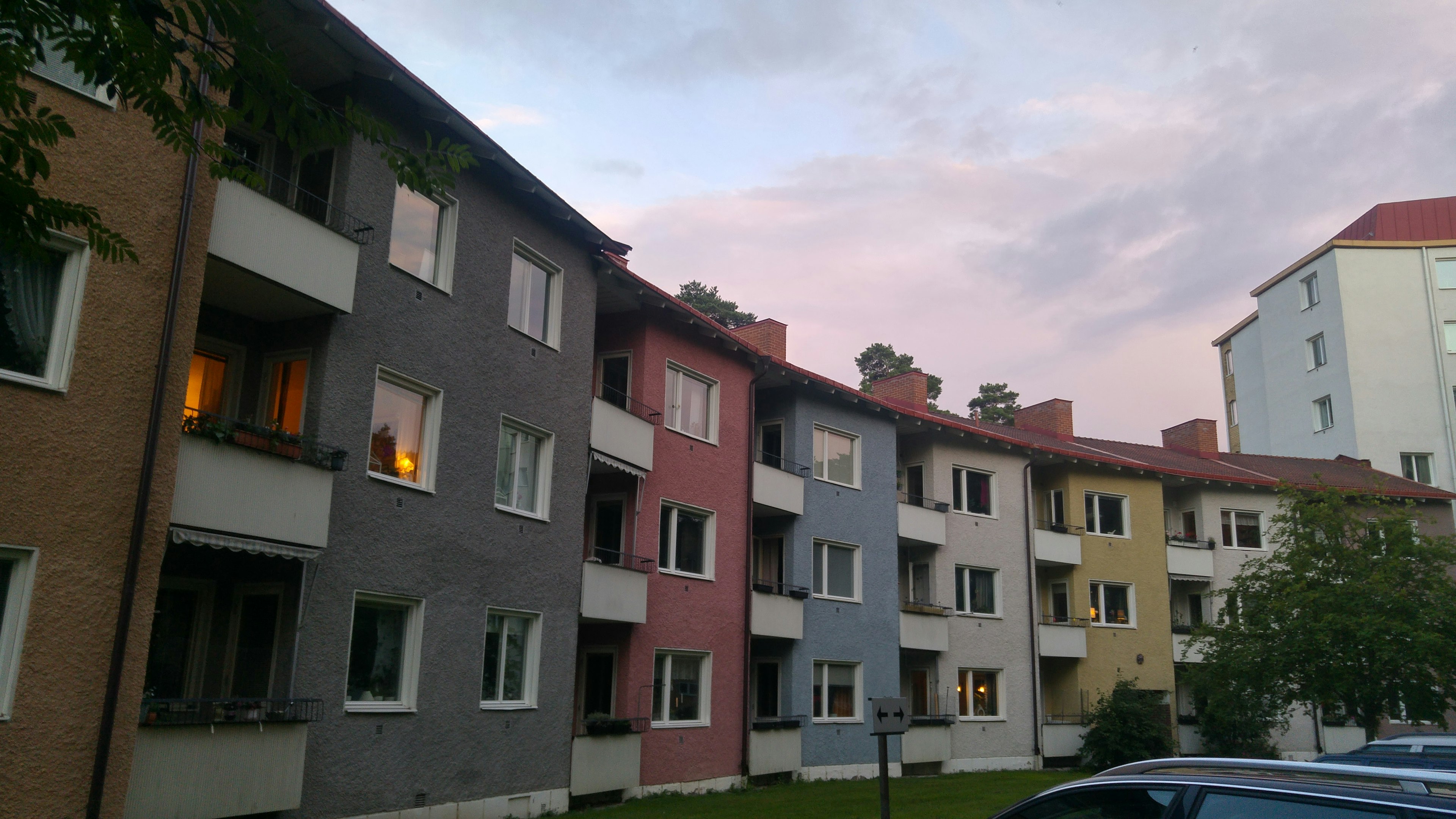 Colorful apartment buildings with a sunset sky