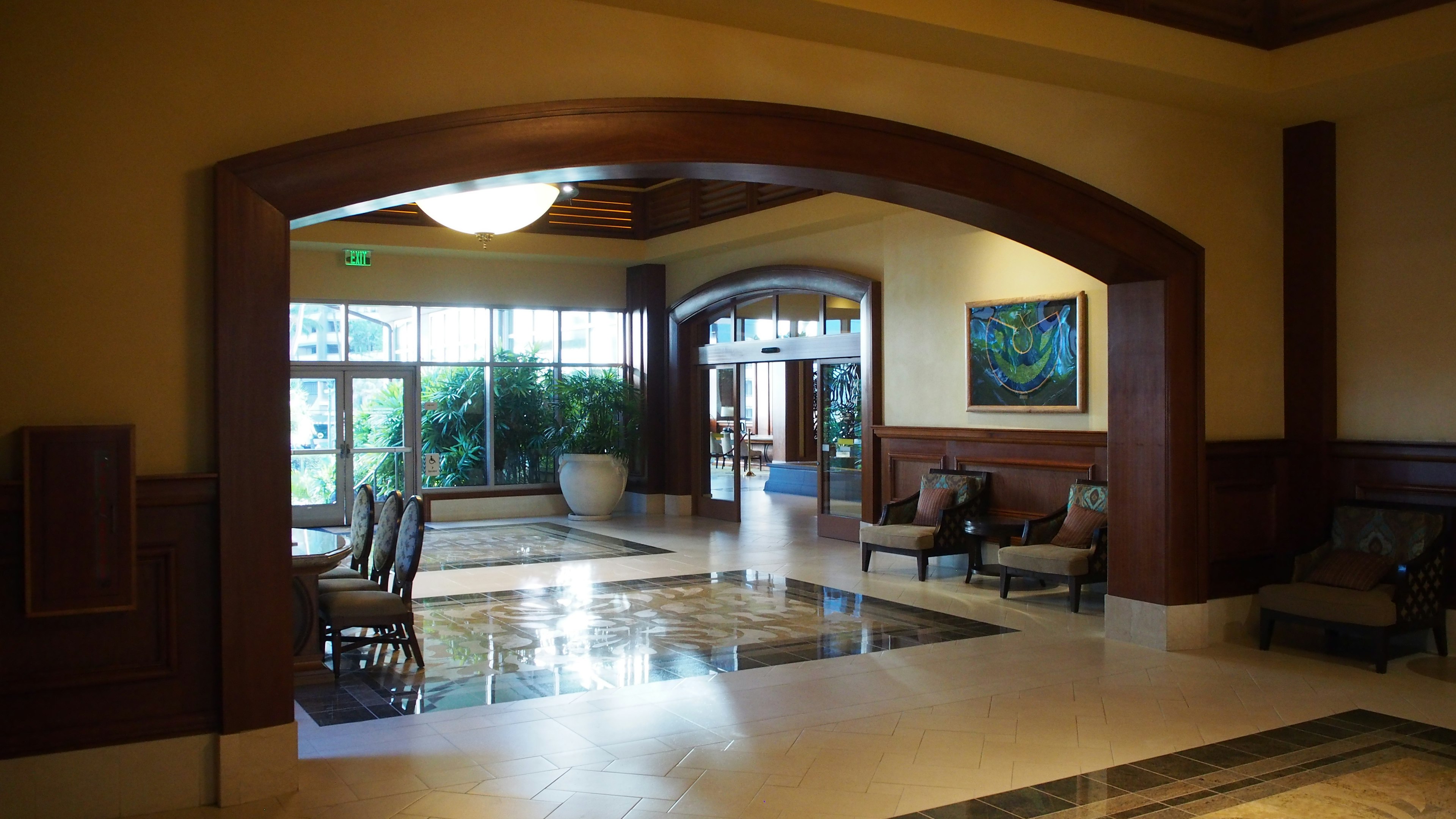 Spacious lobby with arched entrance and comfortable seating arrangement