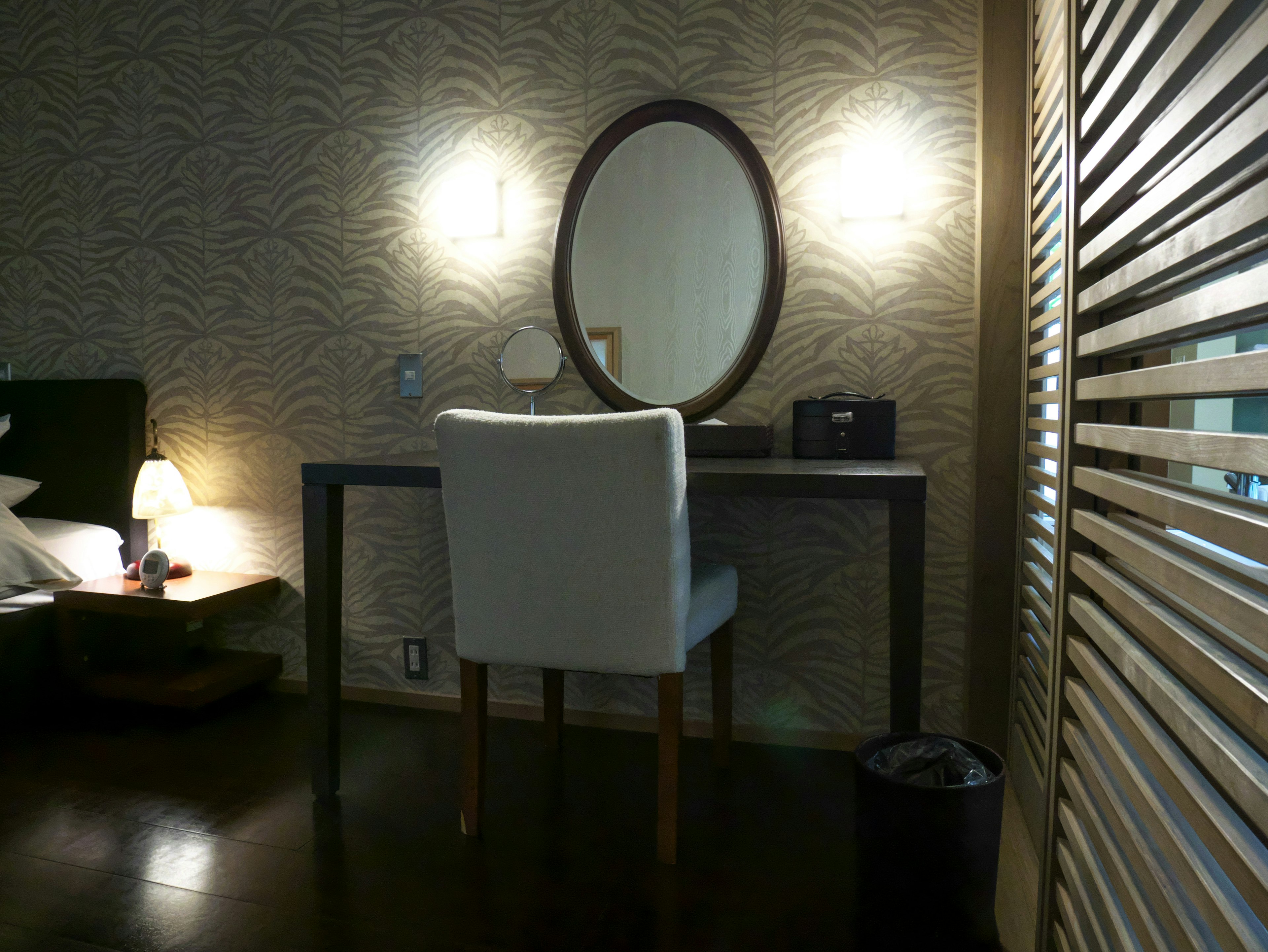 Simple modern dressing table with round mirror in a stylish room