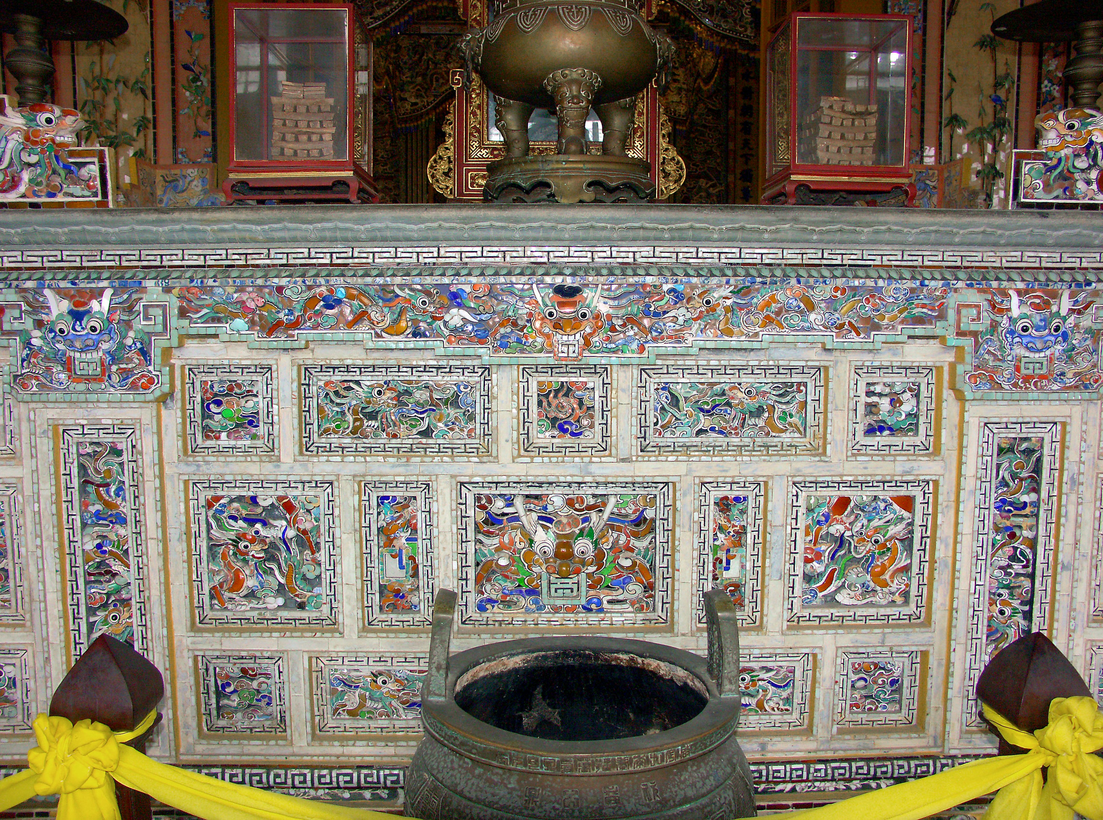 Decorative altar with intricate carvings and colorful tiles