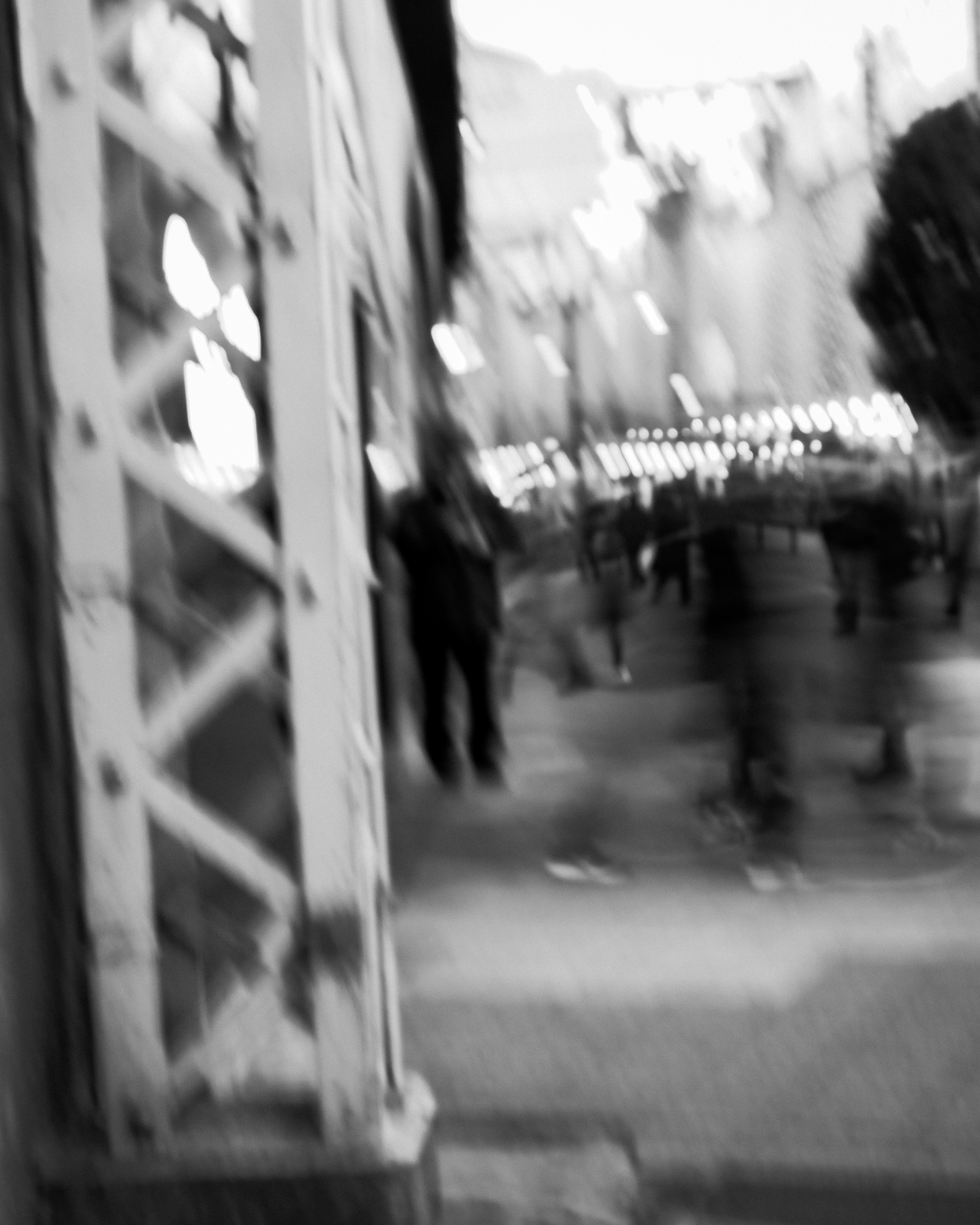 Blurred monochrome scene with people walking