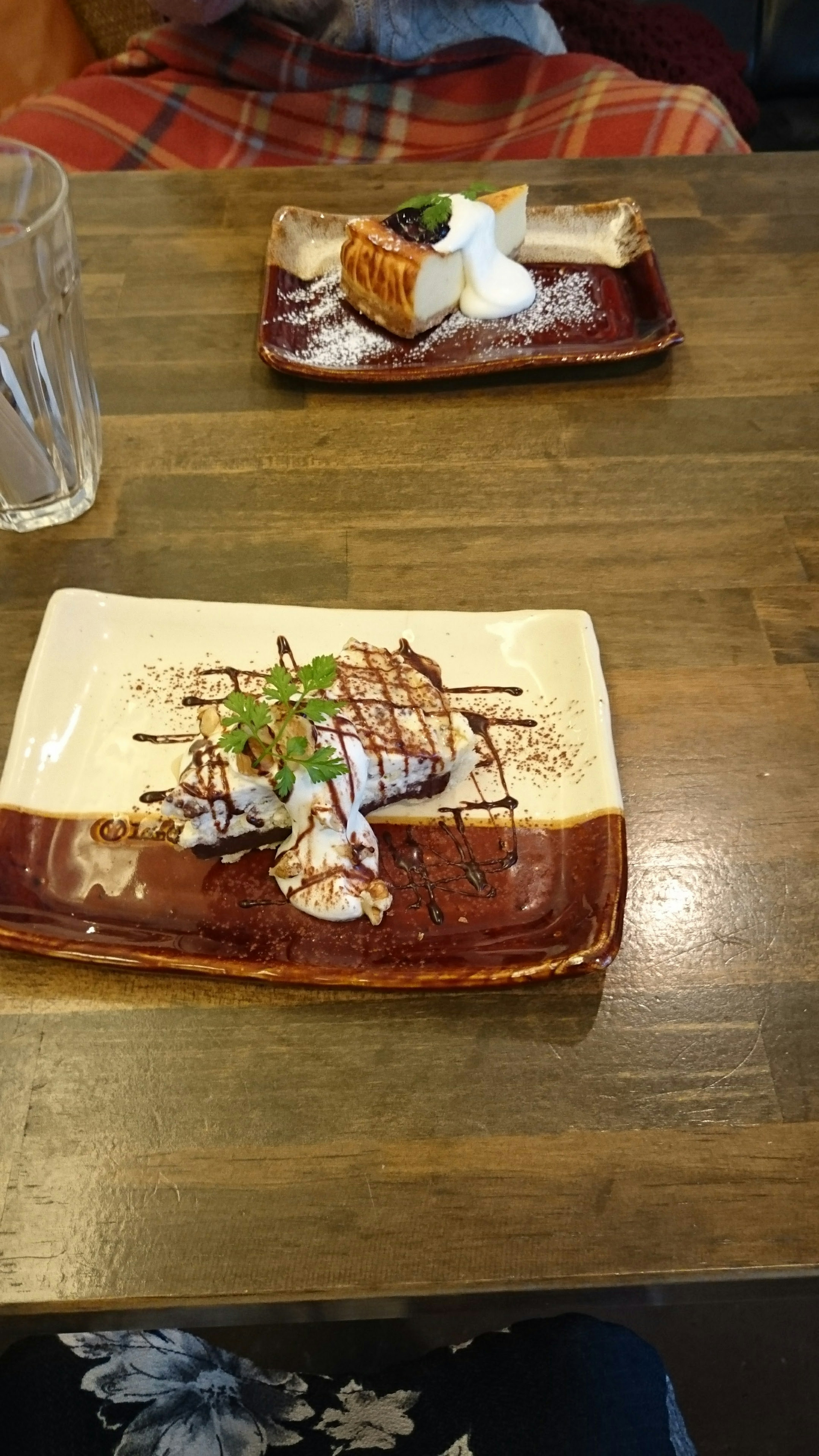 Japanese dishes on a wooden table with a dessert plate