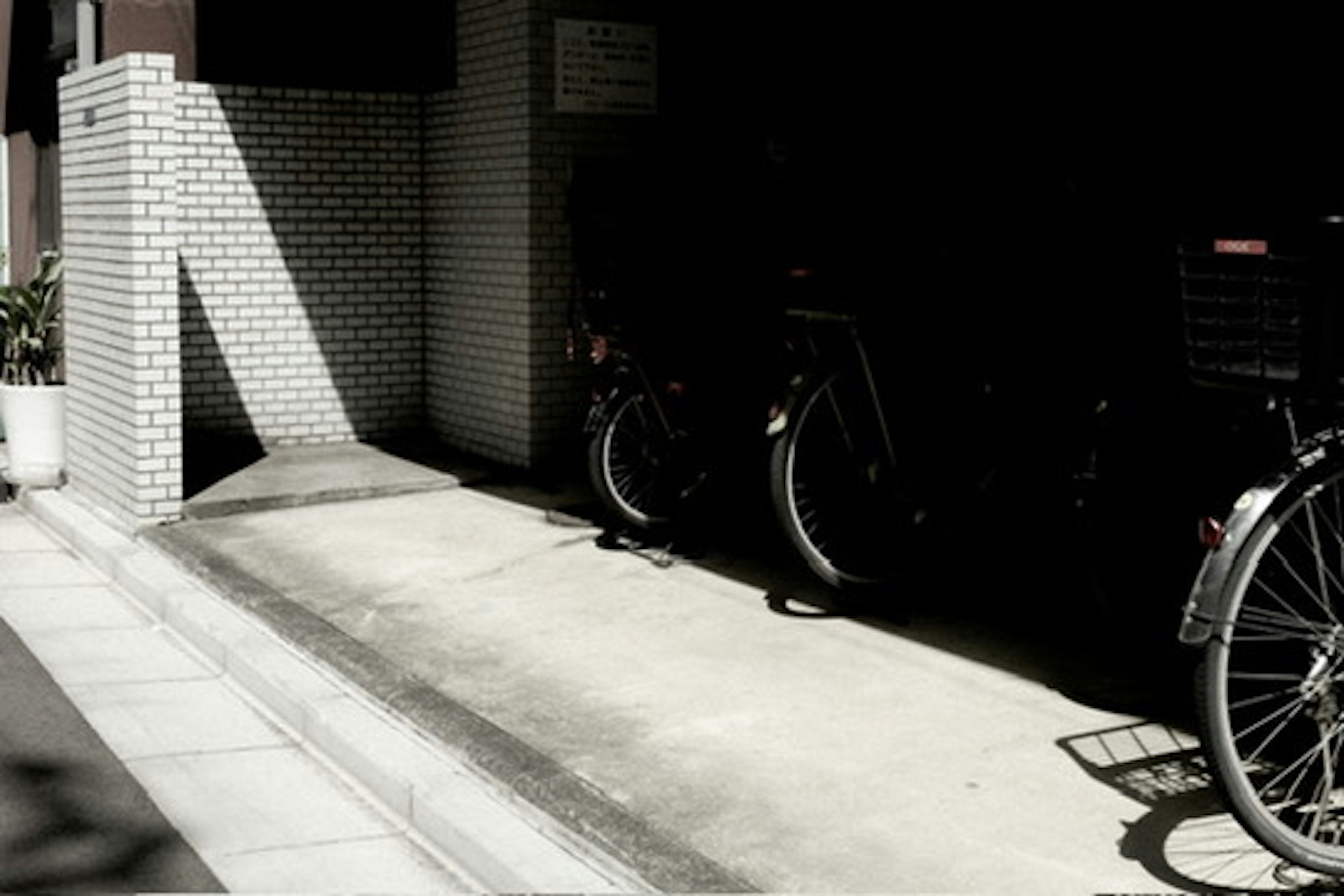 Bicycles parked in a dark parking area