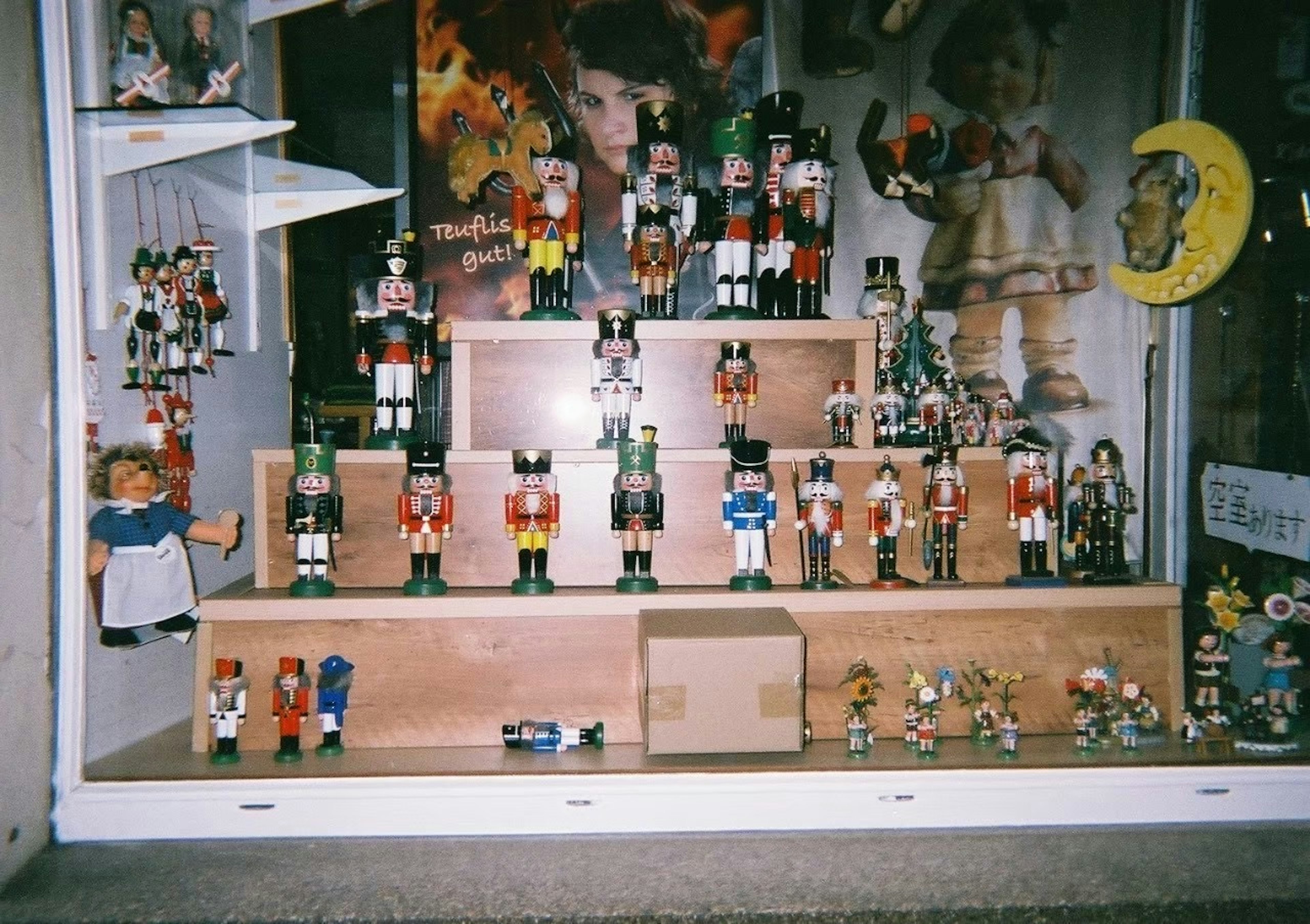 Display of wooden dolls arranged in a shop window