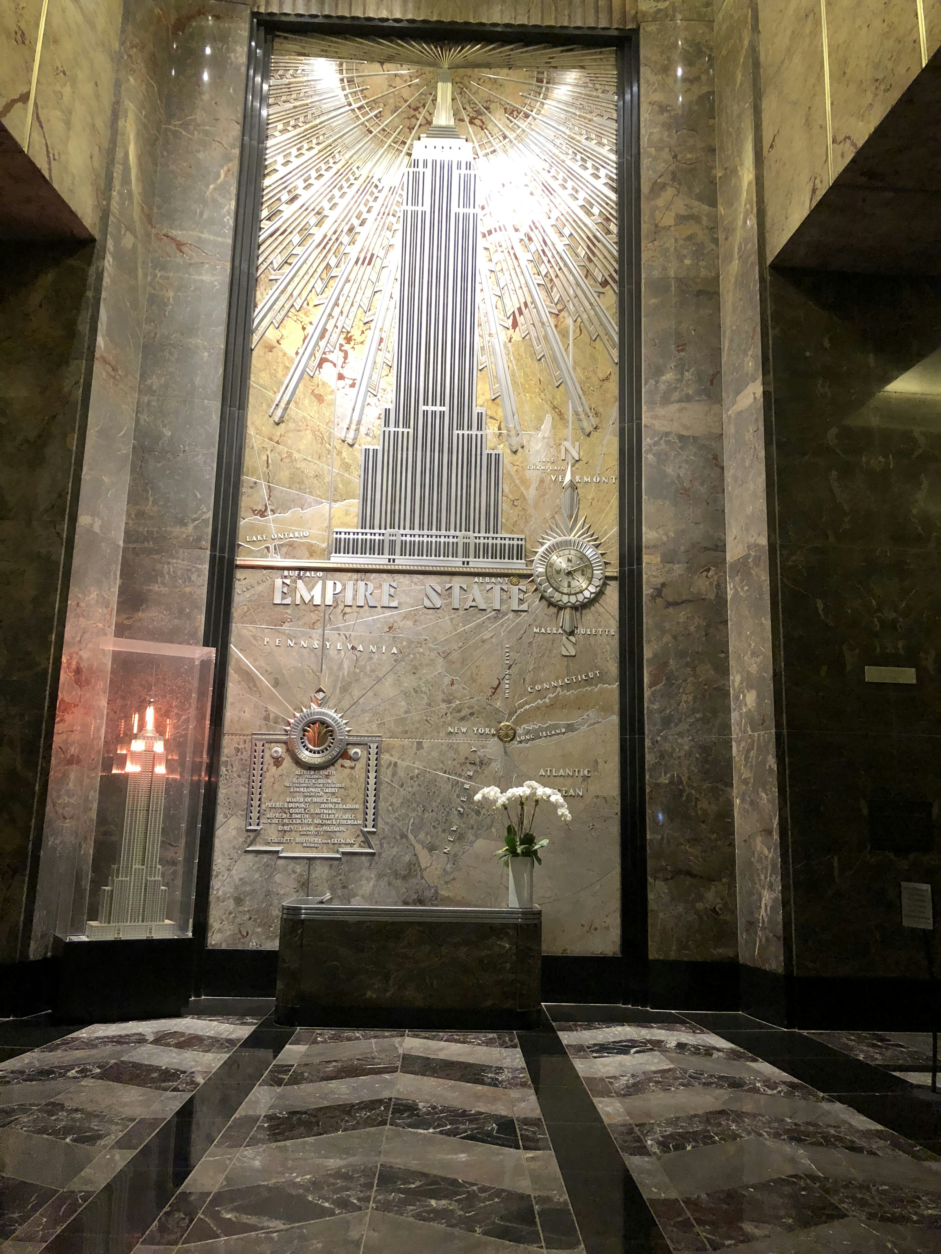 Mosaic art of the Empire State Building with elegant marble interior