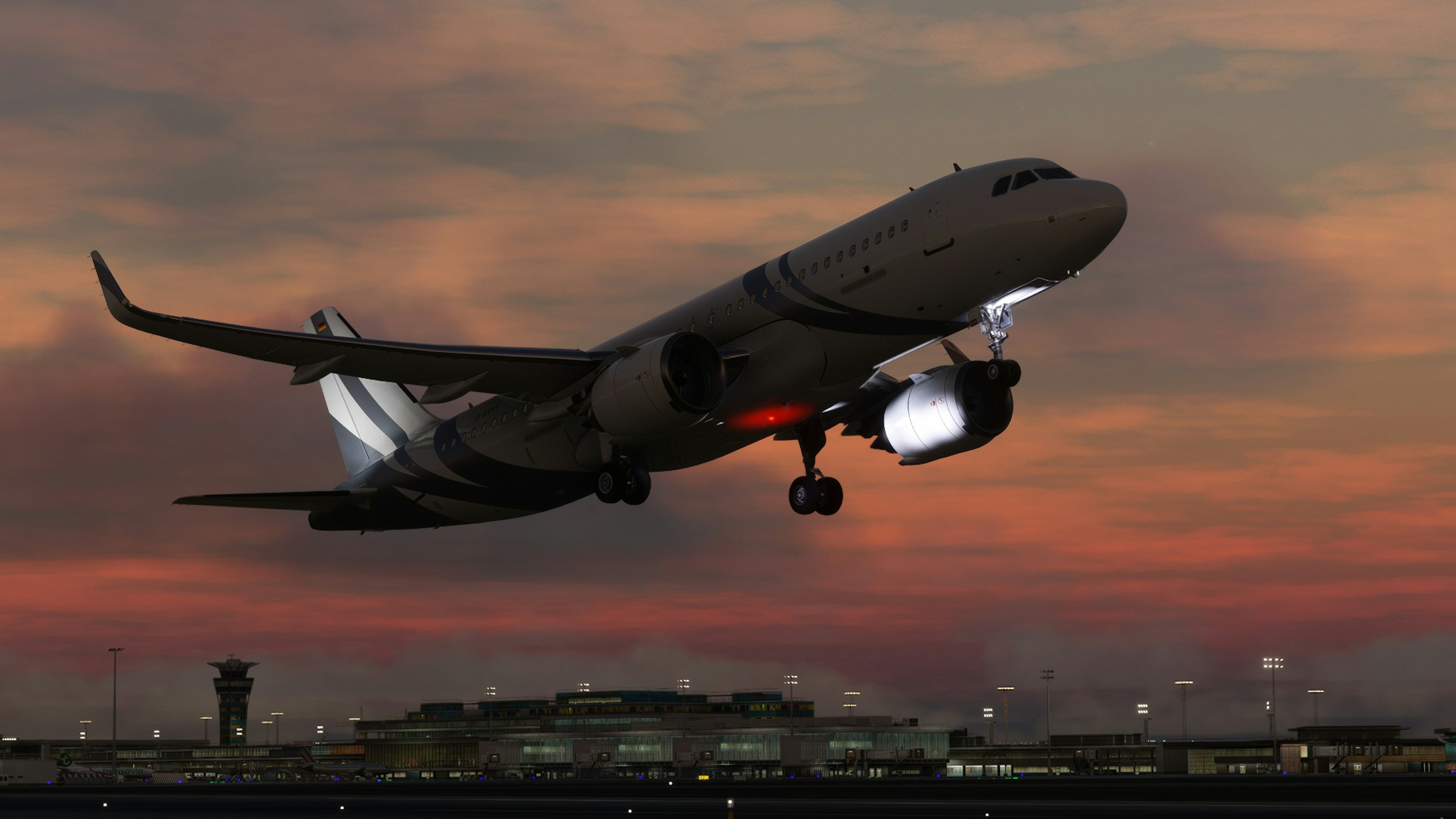 Silhouette of an airplane taking off against a sunset sky