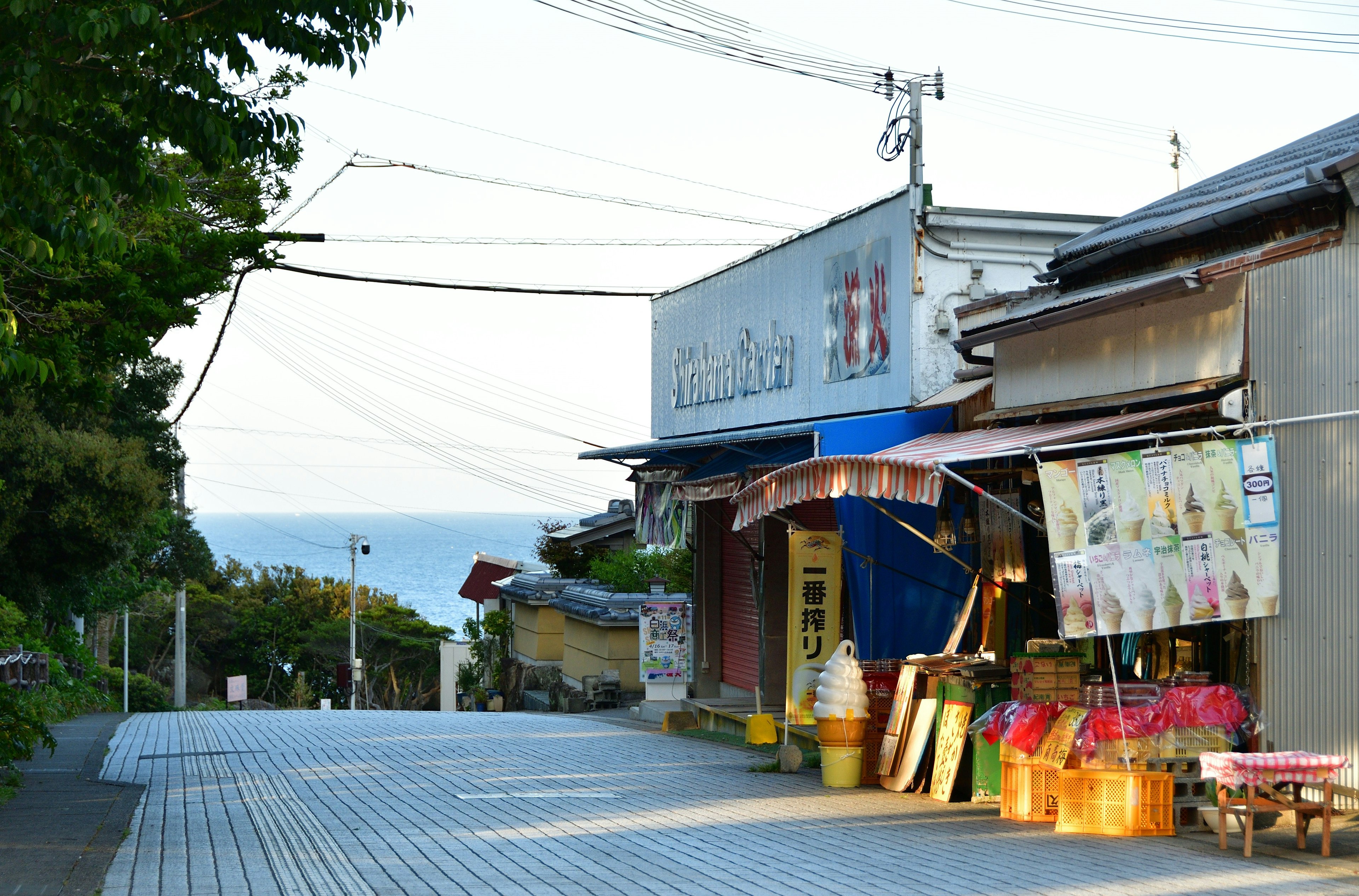 Scenic view of a shop street with an ocean backdrop