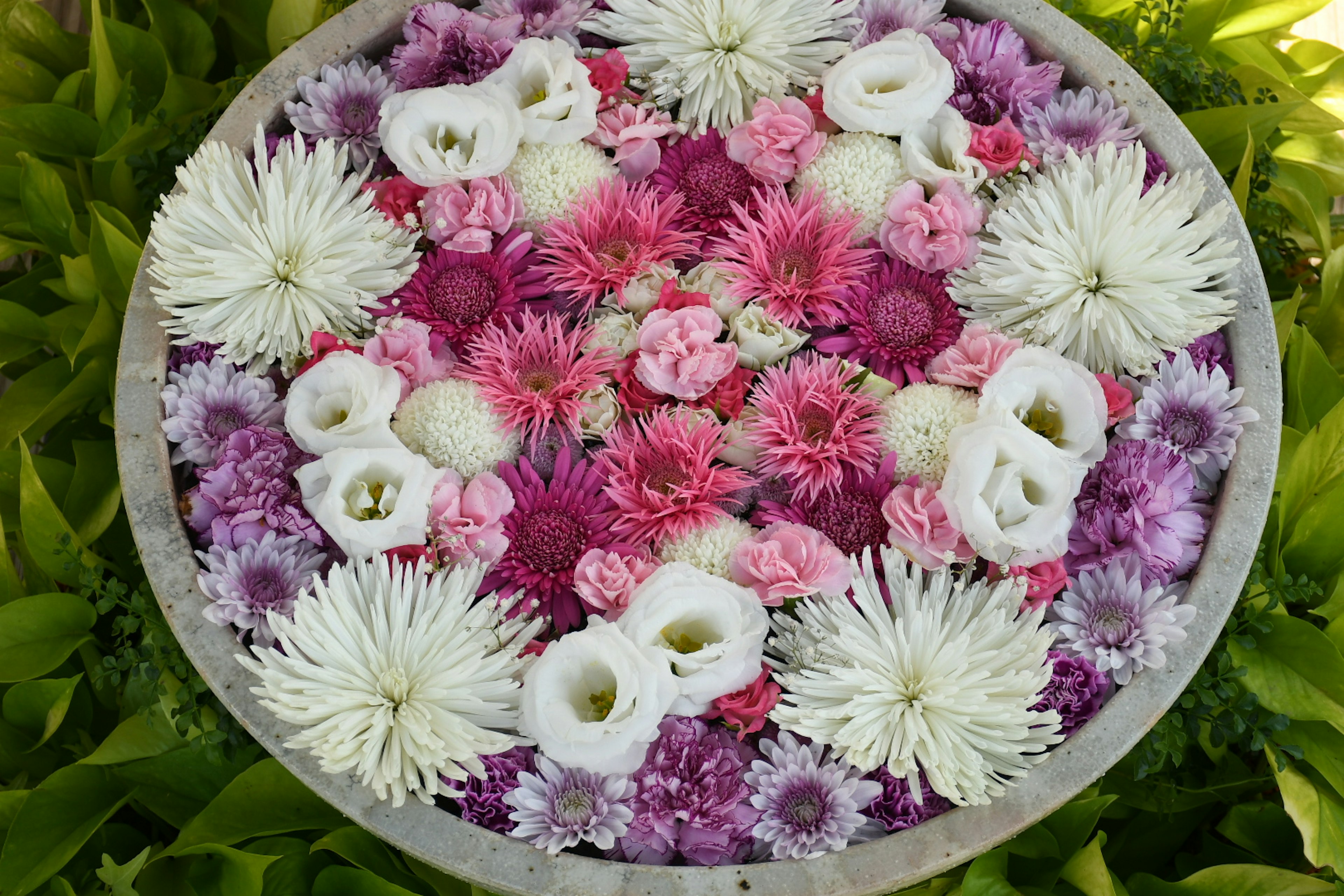 A decorative floral arrangement featuring various colorful flowers