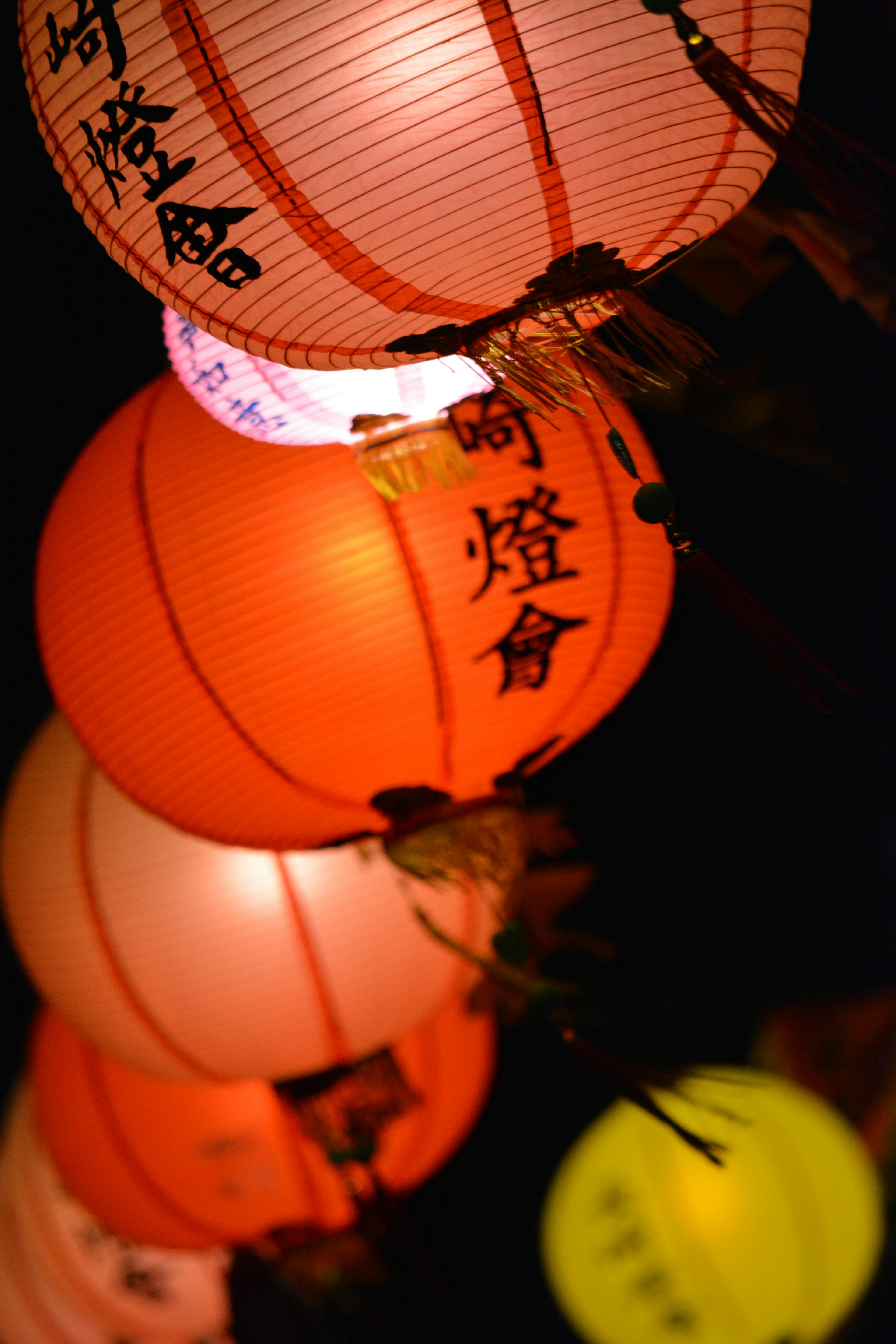 A row of colorful lanterns glowing at night