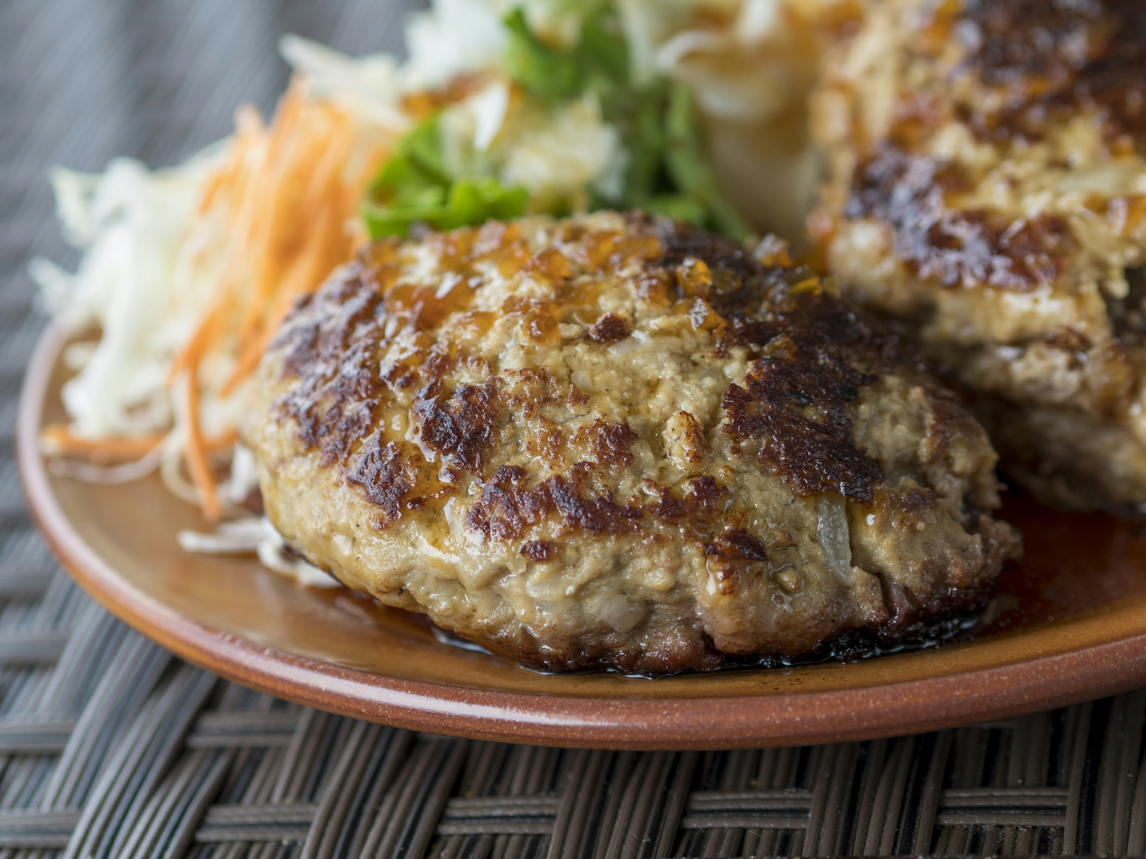 Grilled hamburger steak served with fresh vegetables