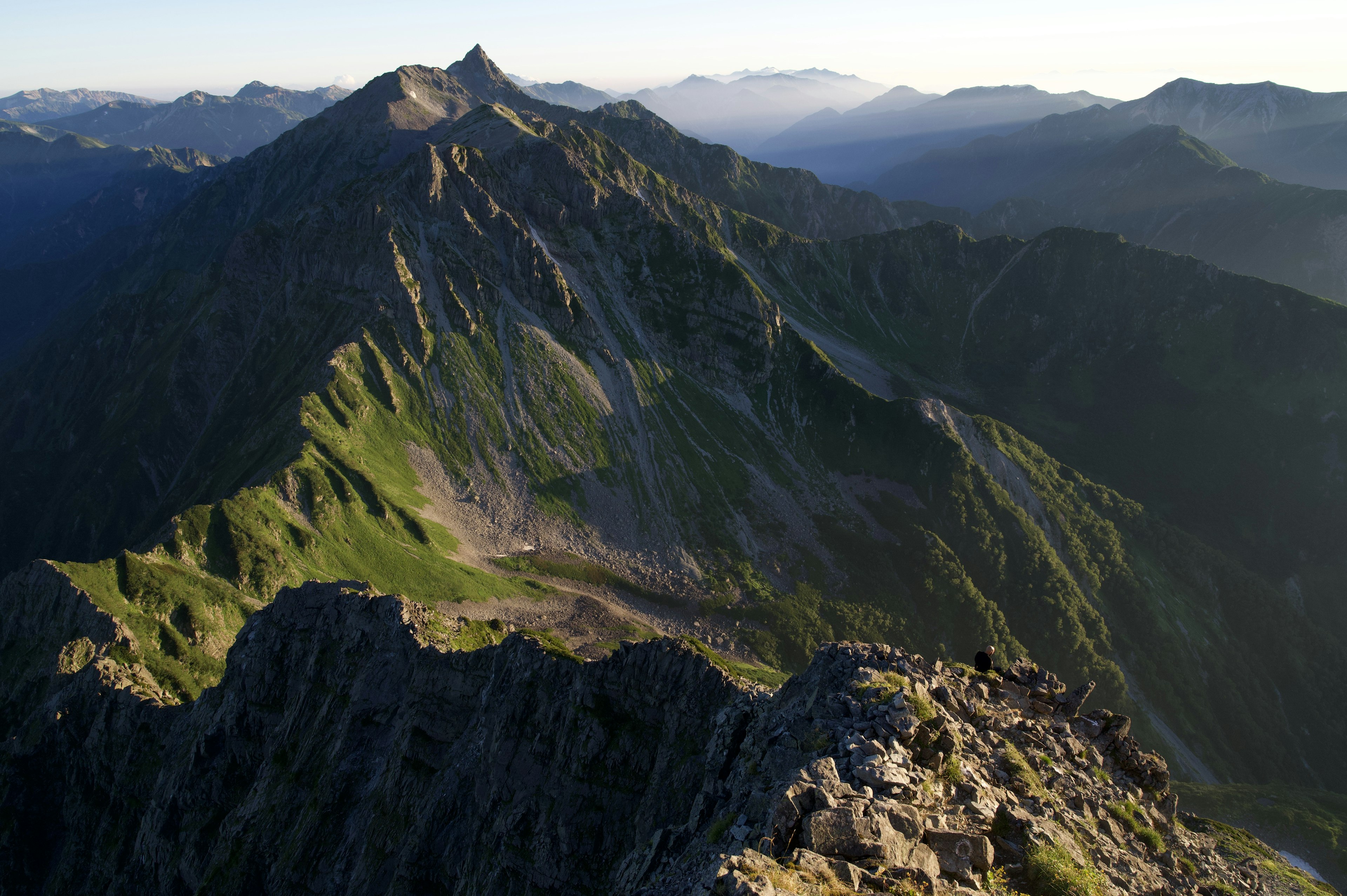 Stunning landscape from mountain peak green and rocky terrain