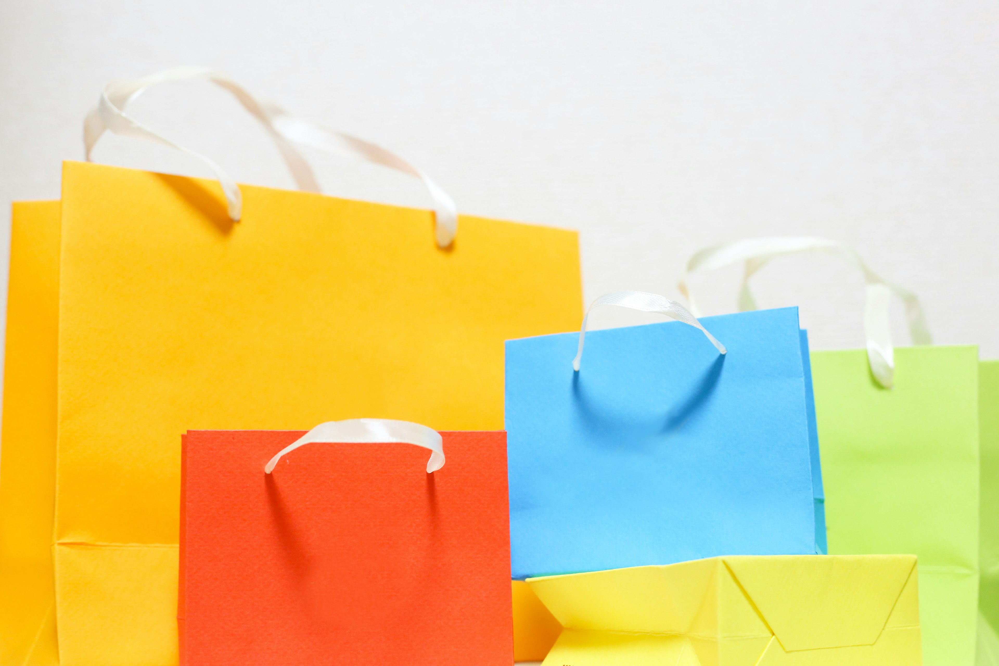 Colorful shopping bags arranged in various sizes