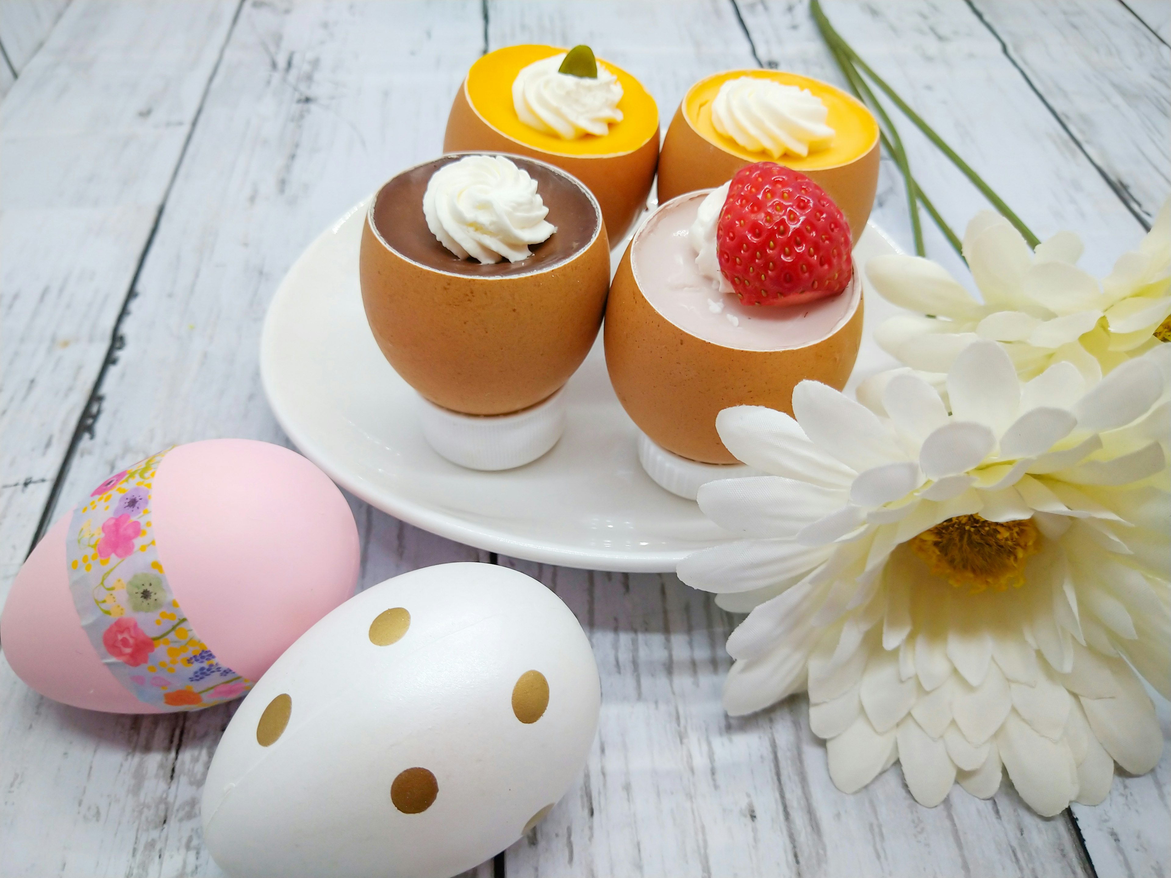 Colorful desserts served on a plate with a flower