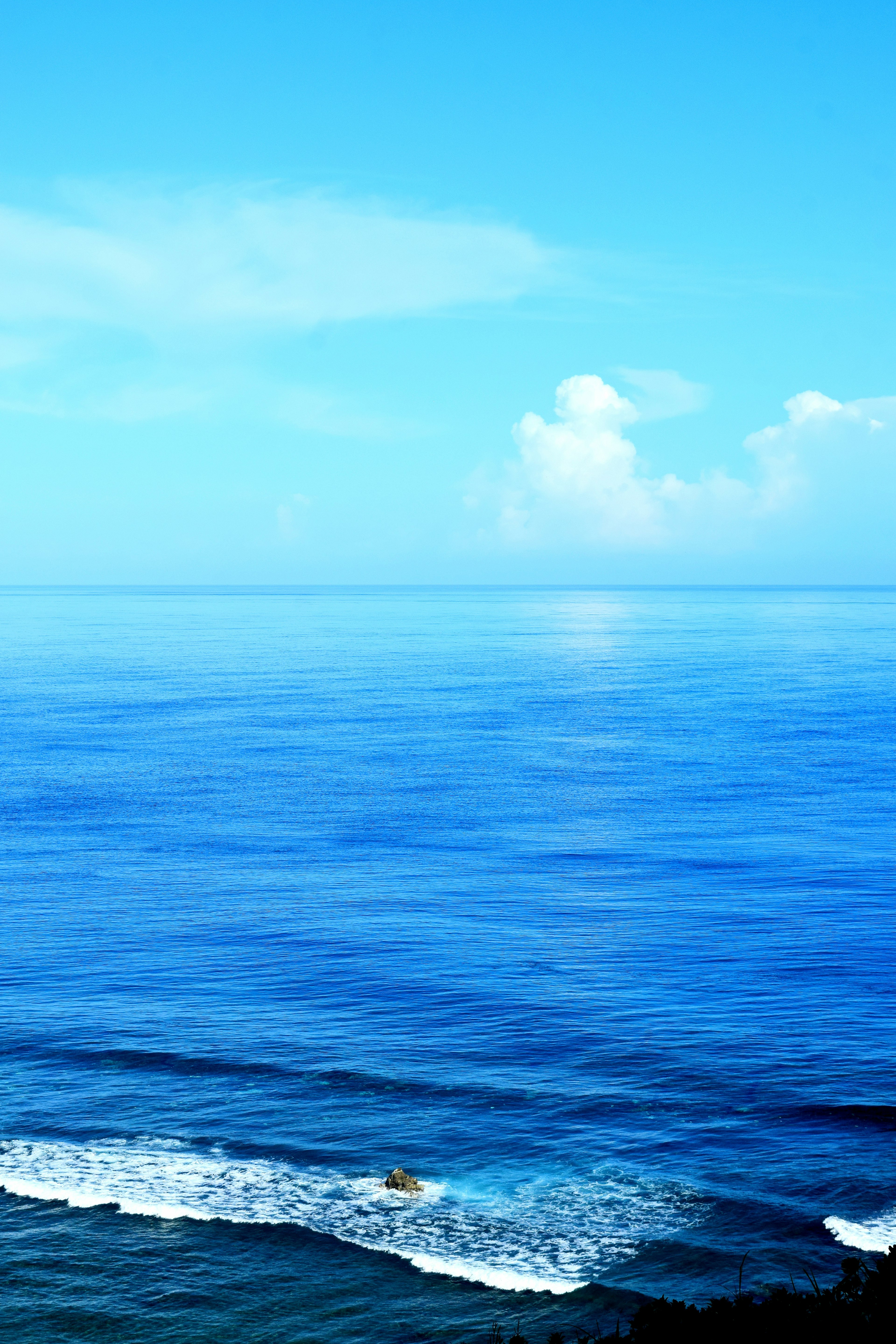 Serene blue ocean and sky landscape