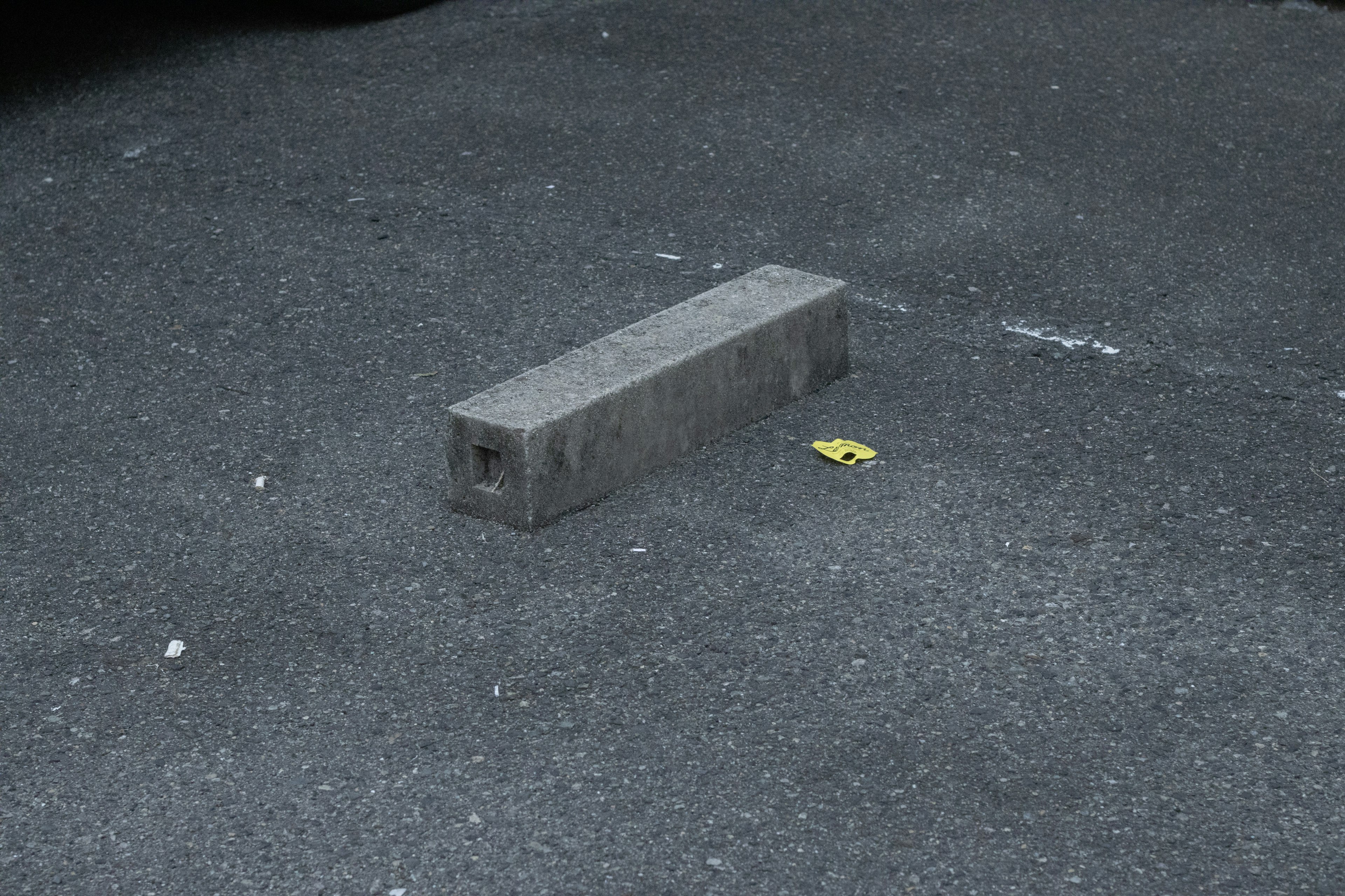 Gray block placed on asphalt surface