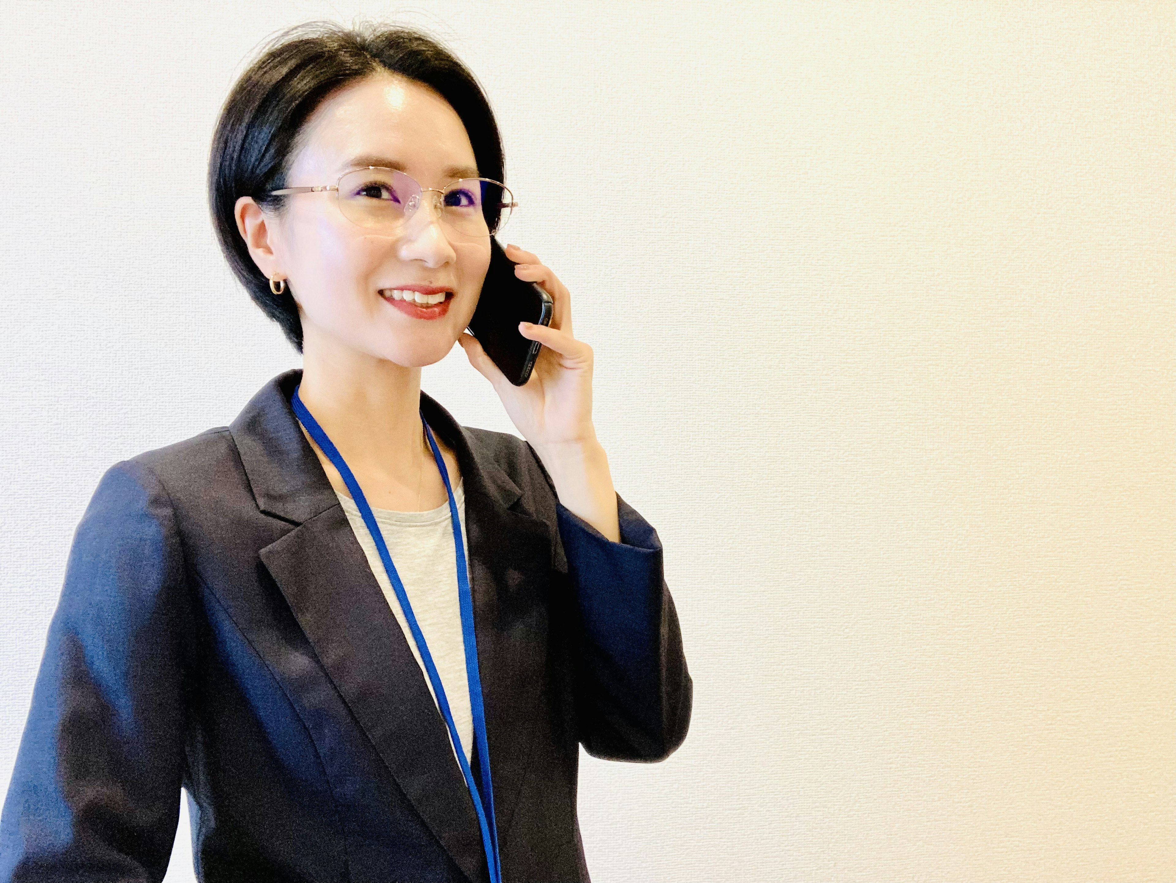 Businesswoman in a suit speaking on the phone