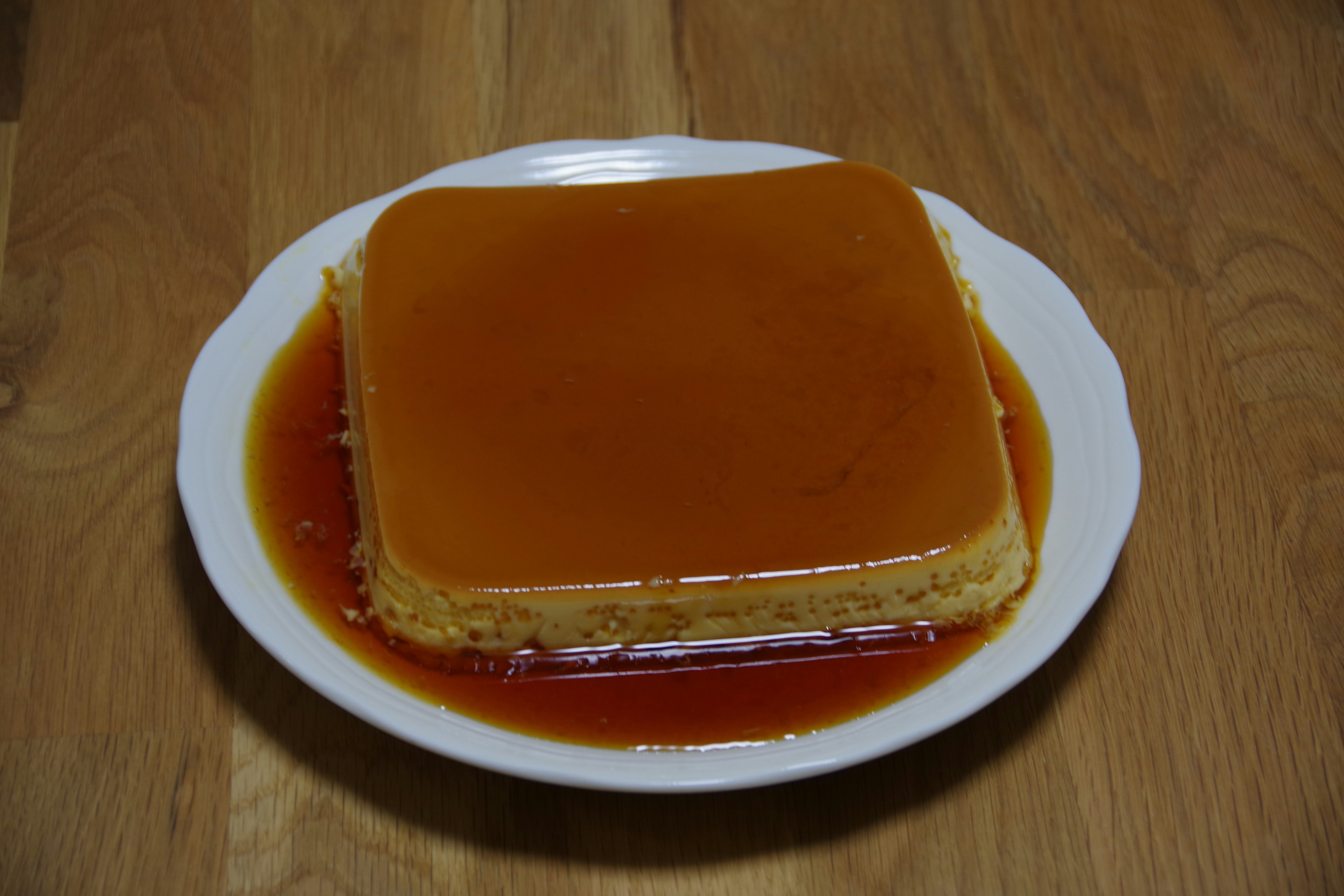 Square flan topped with caramel sauce