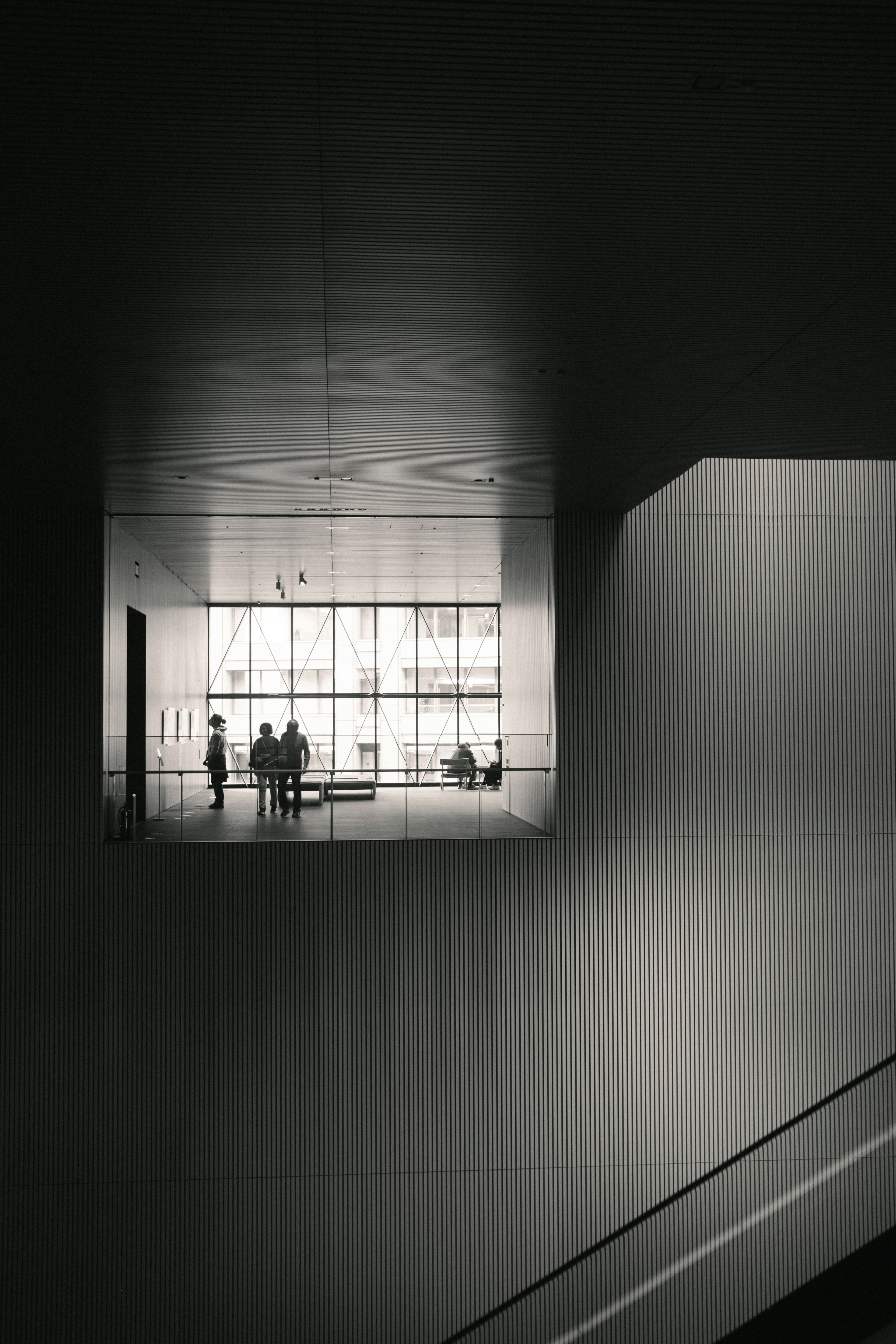 Modern building interior with people gathered in a well-lit area