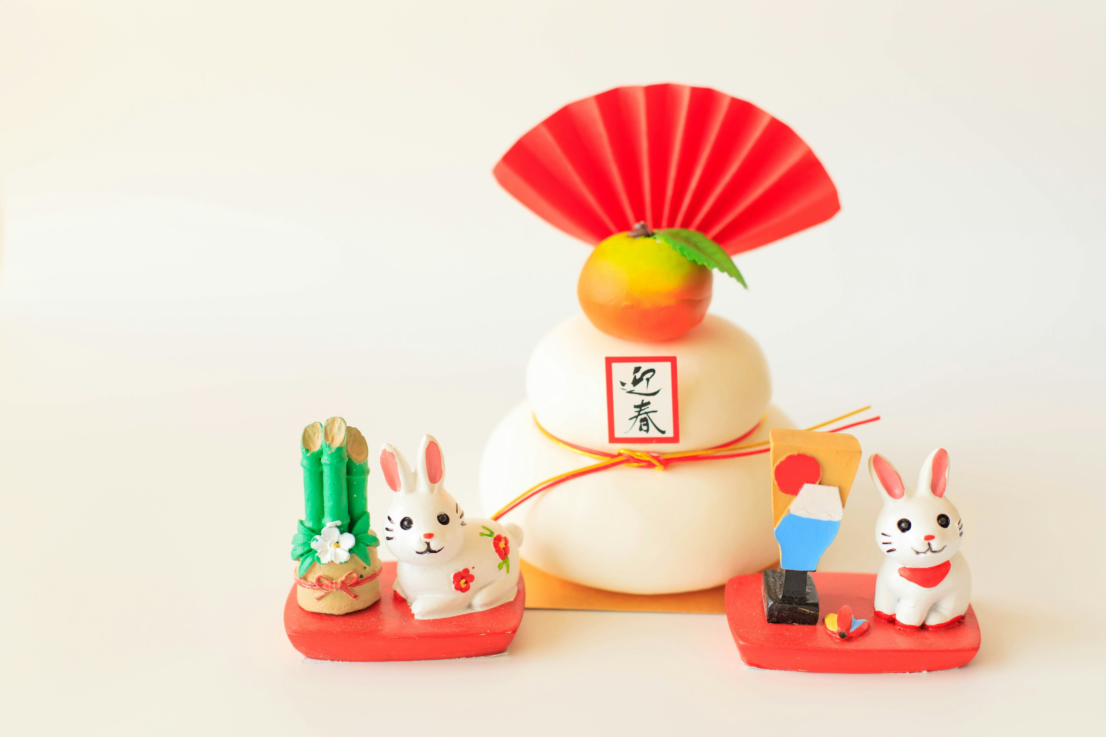 Decorative New Year rice cake with rabbit figurines