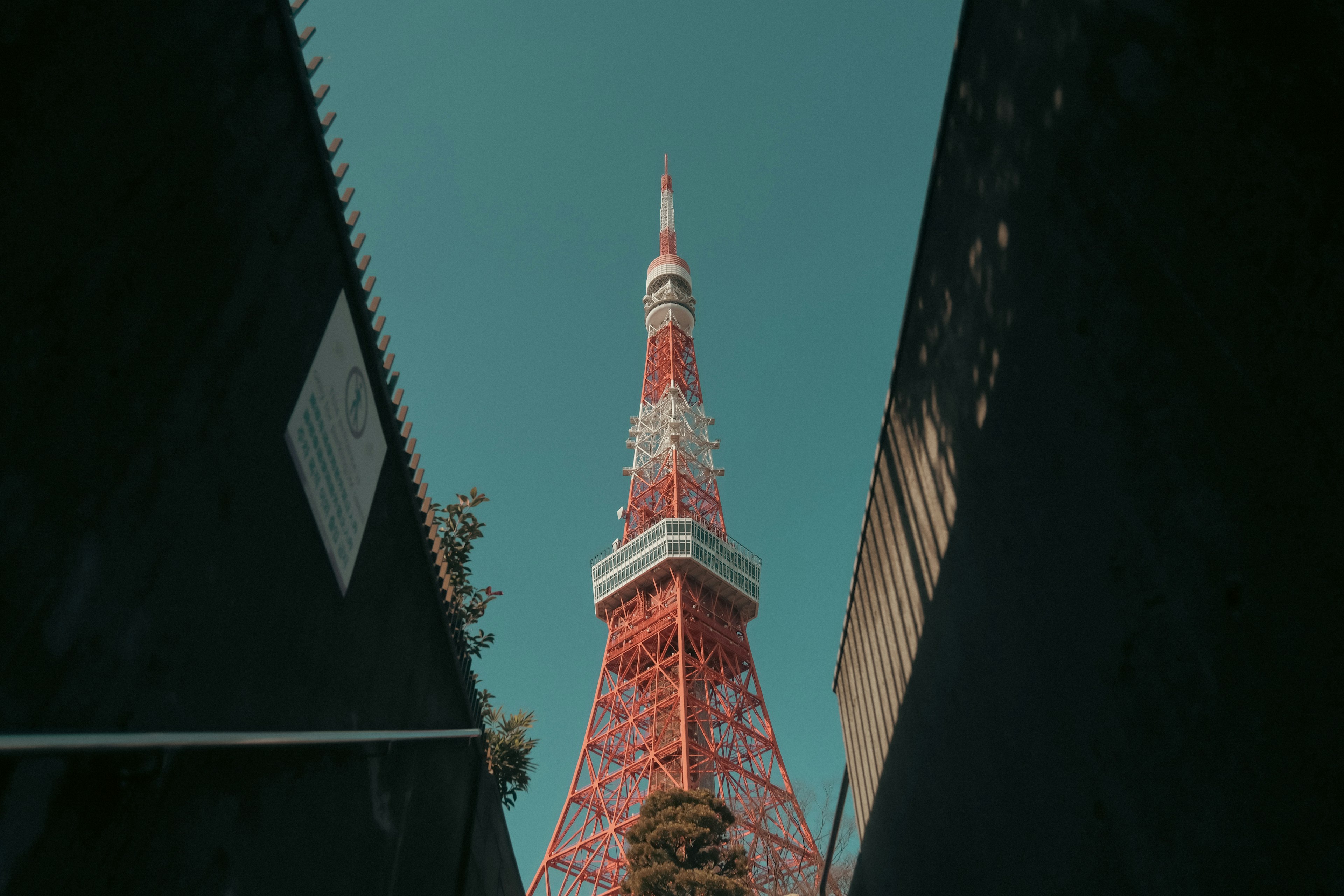 Tokyo Tower towering under a blue sky