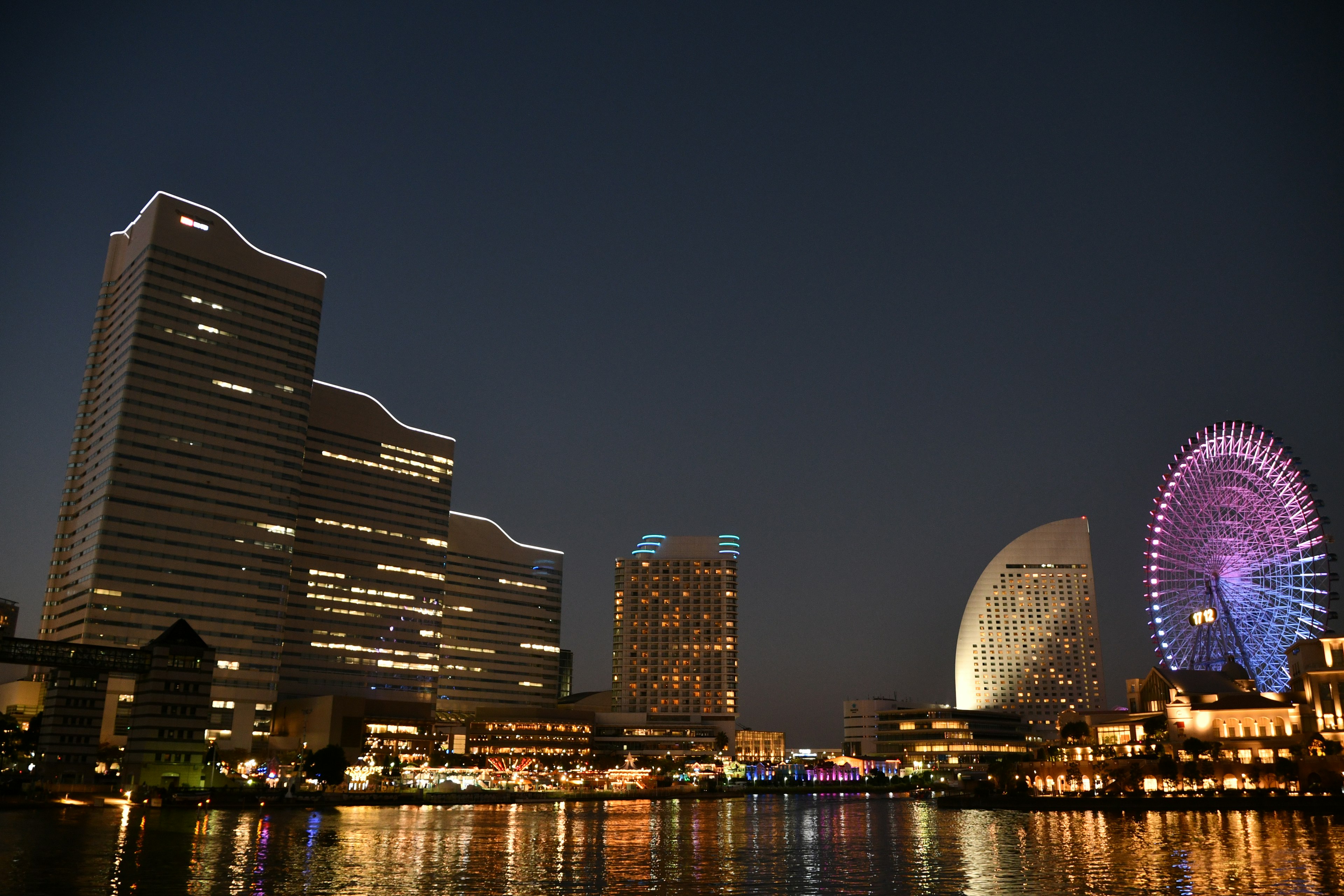 Night view of Yokohama skyline with a ferris wheel