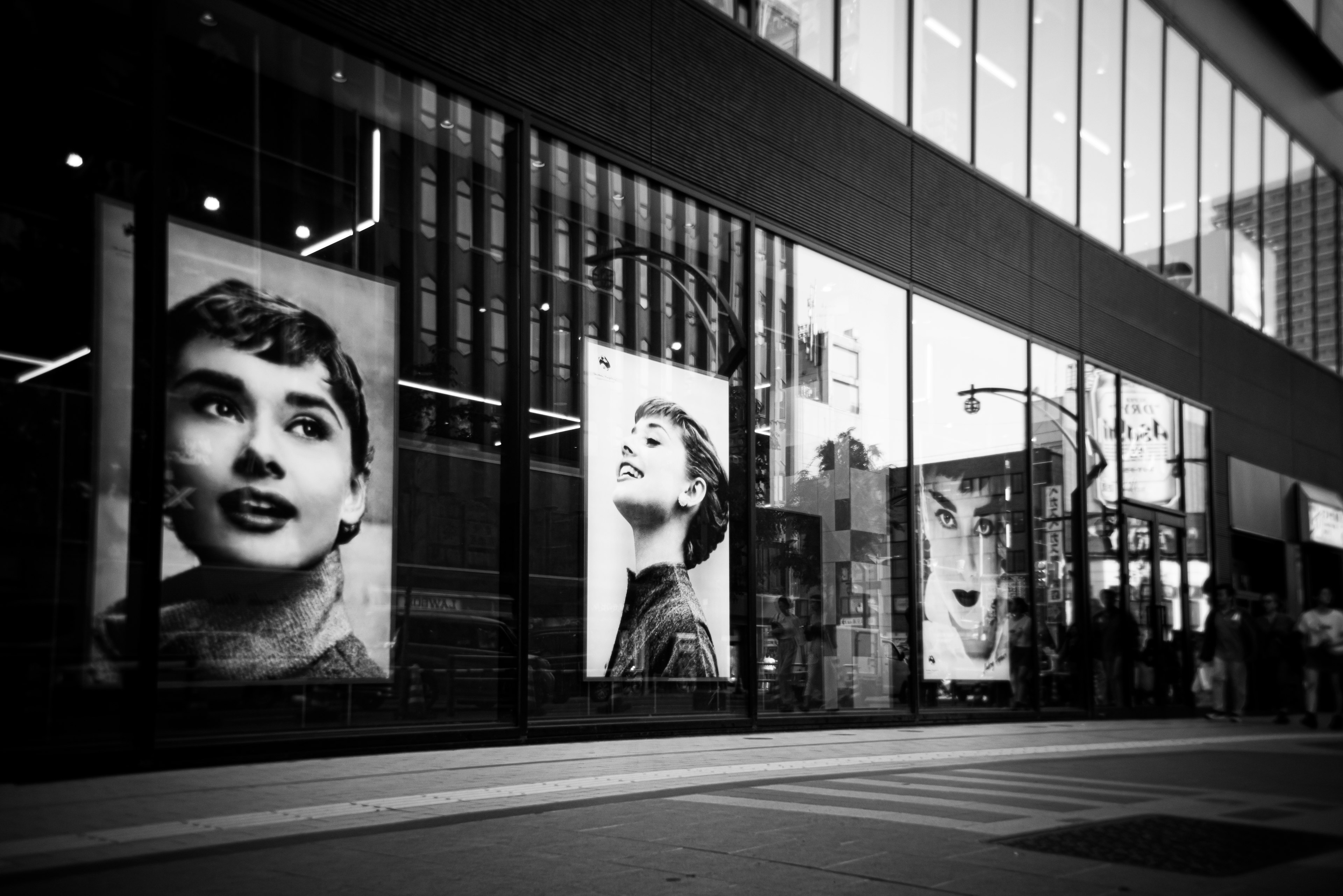 Black and white window display featuring portraits of Audrey Hepburn