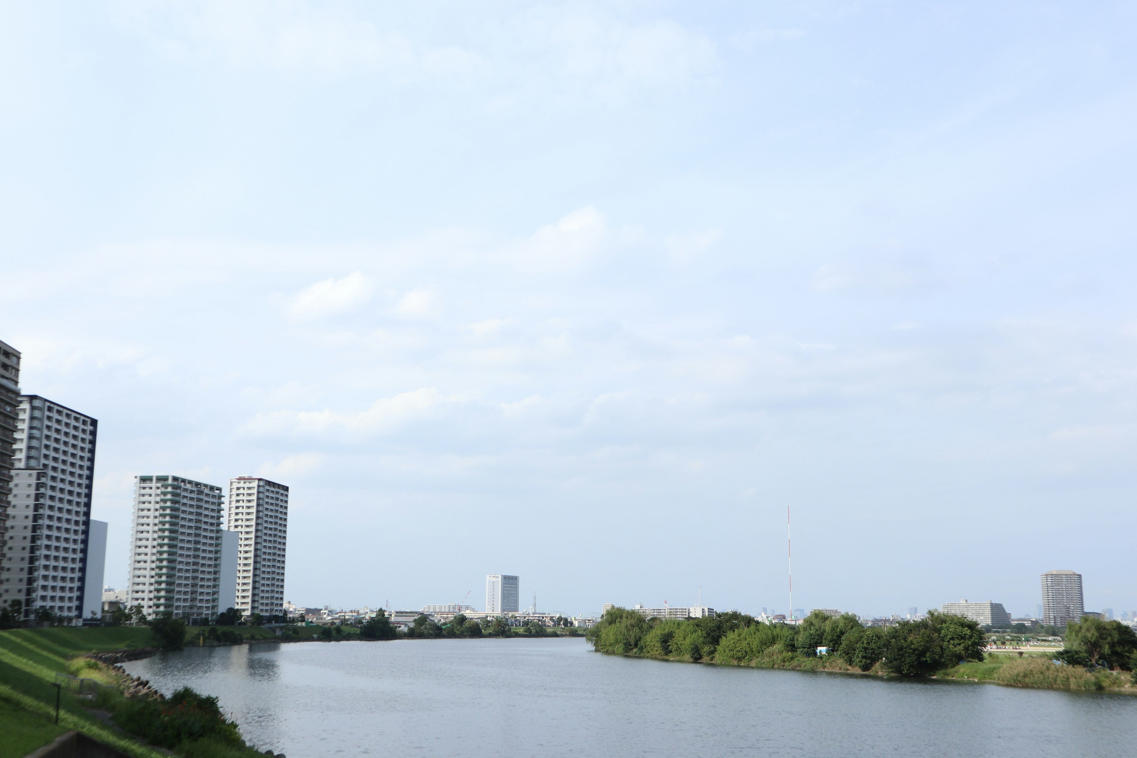 Landscape featuring a river and tall buildings