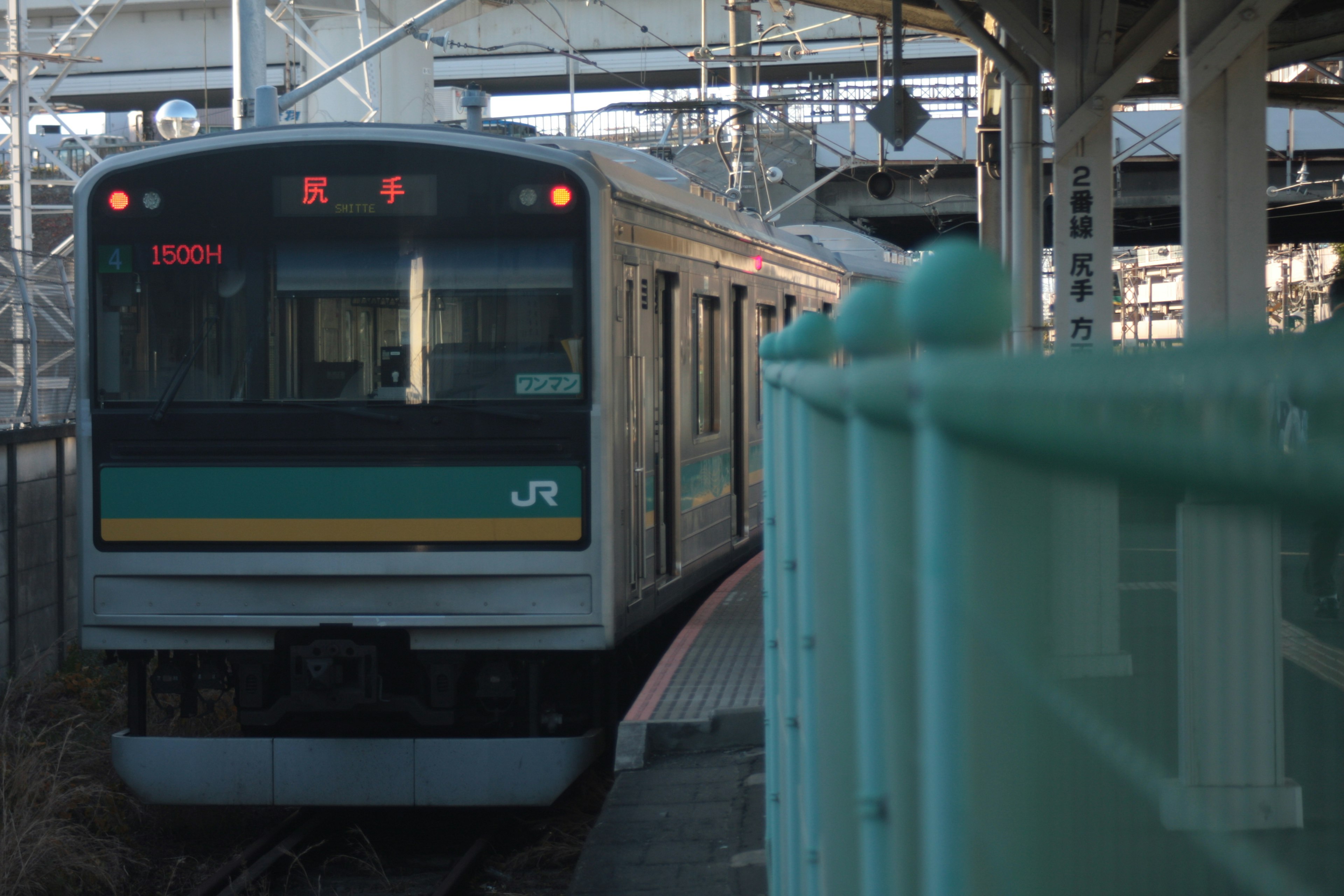 JR train stopped at a station platform