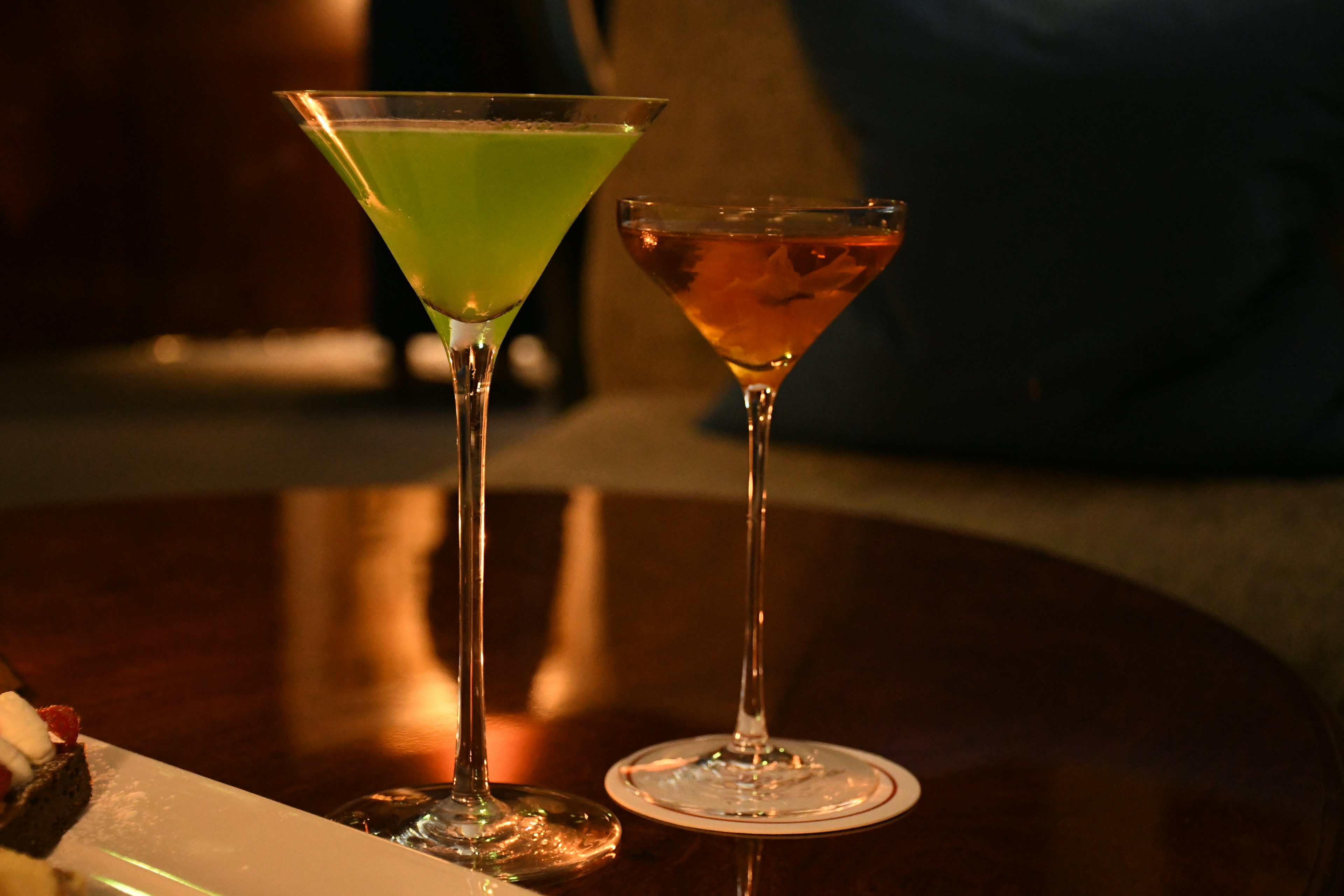 Green and brown cocktails placed on a table