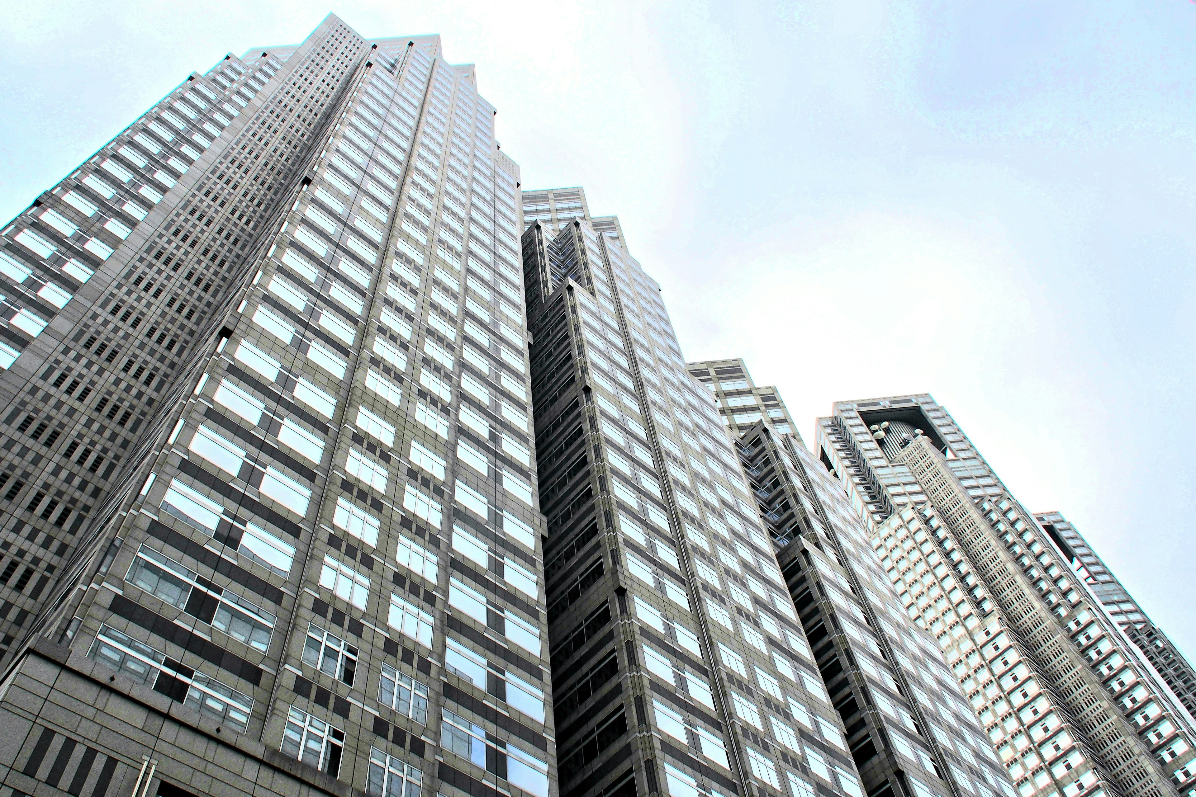 Tall skyscrapers reaching towards a clear blue sky