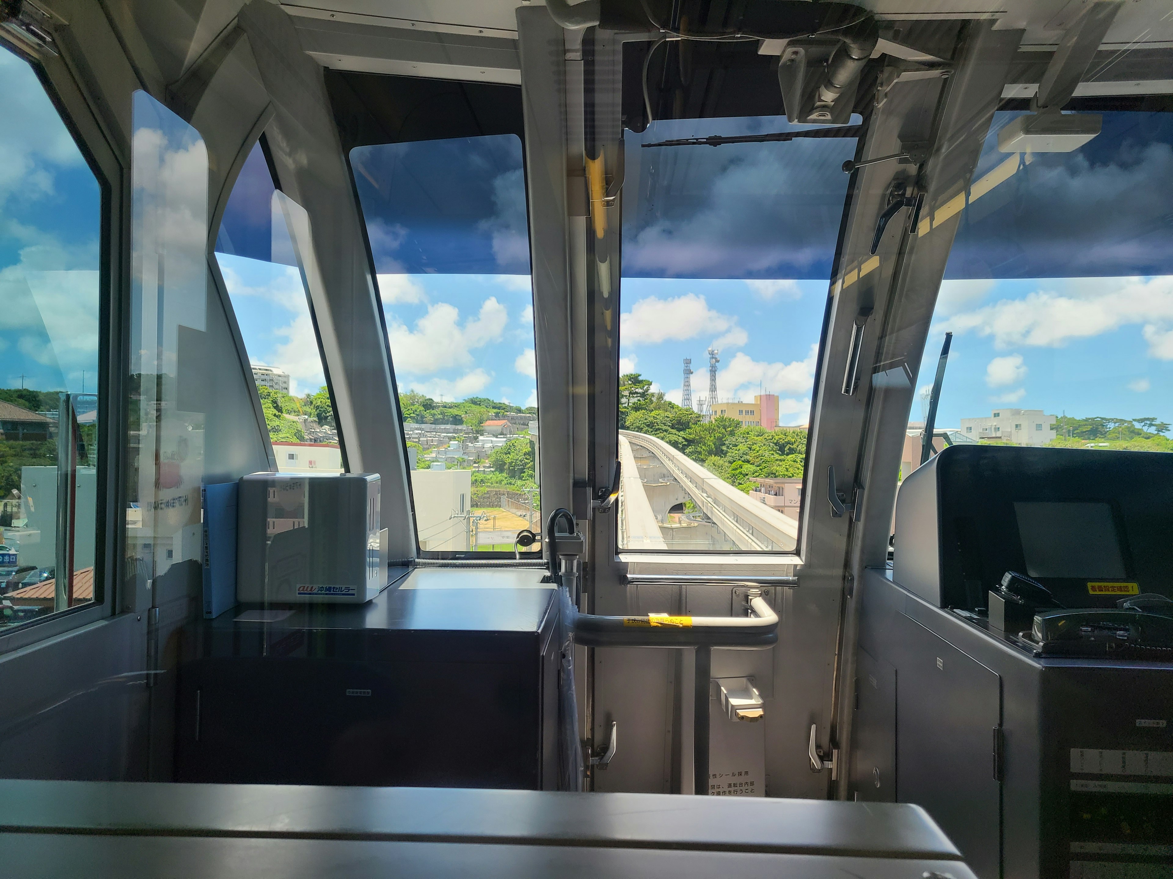 View from the driver's cabin showcasing the sky and railway